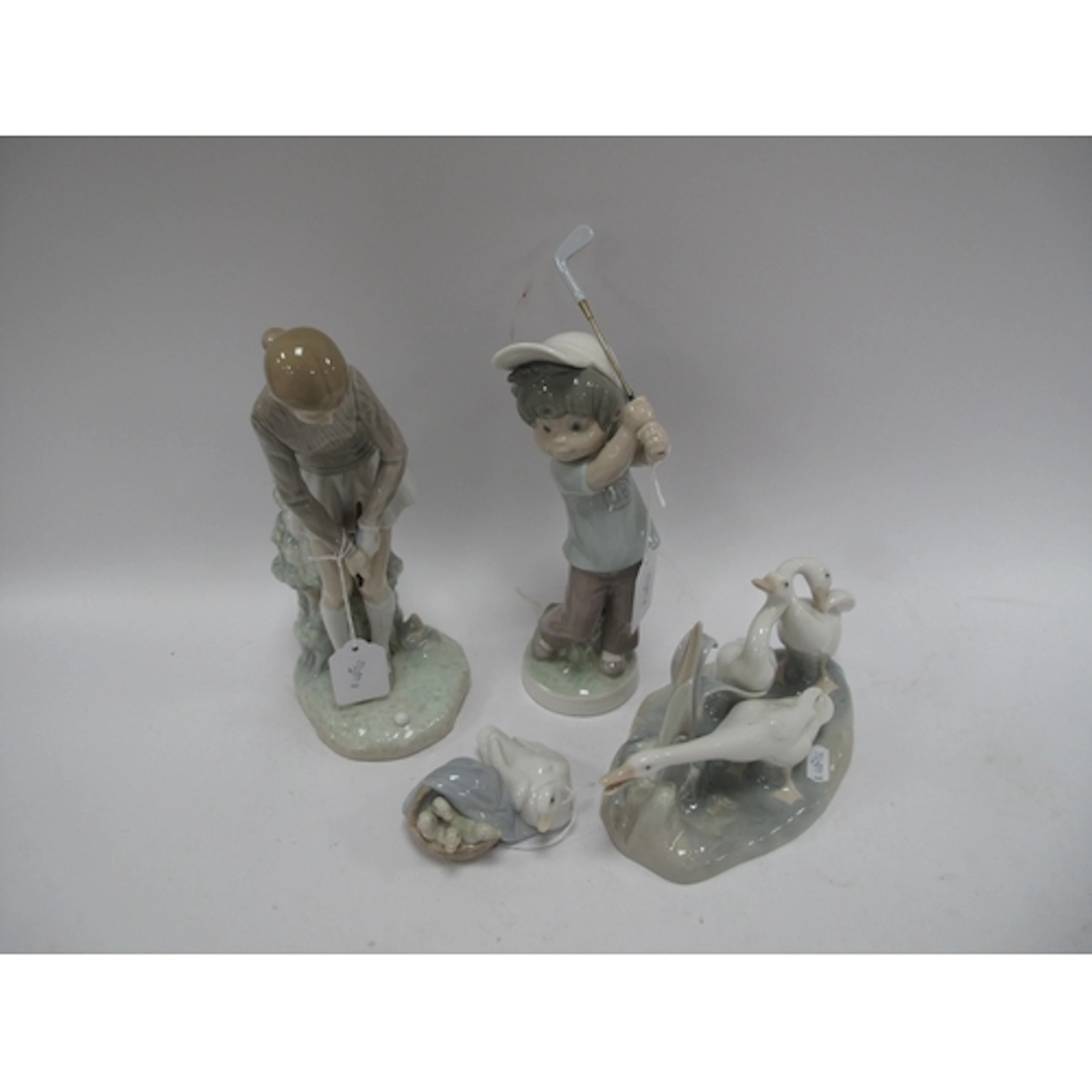 Lladro Sport Billy Golfer Boy, taller girl (club bottom abse...