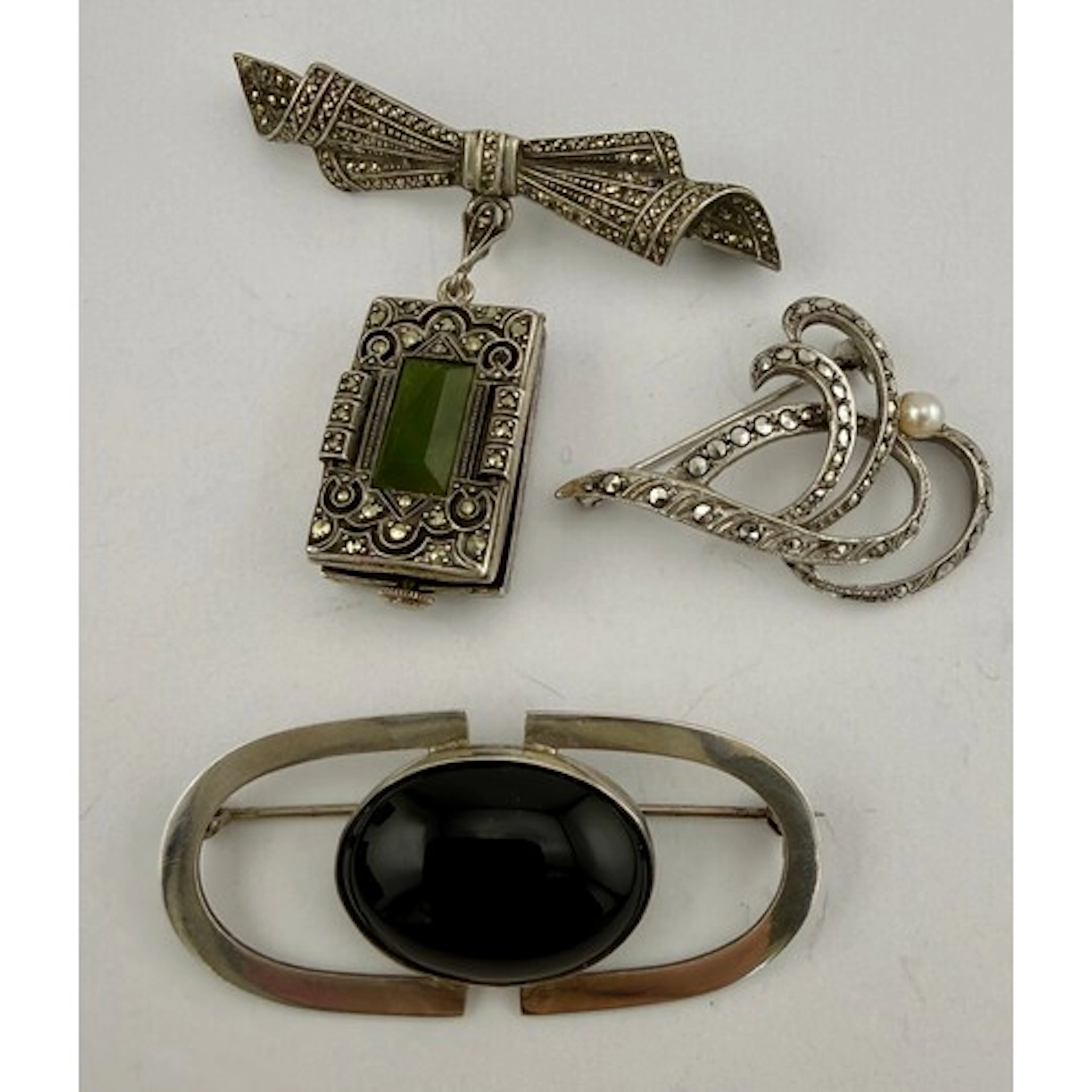 Silver and black onyx brooch, white metal watch brooch marke...