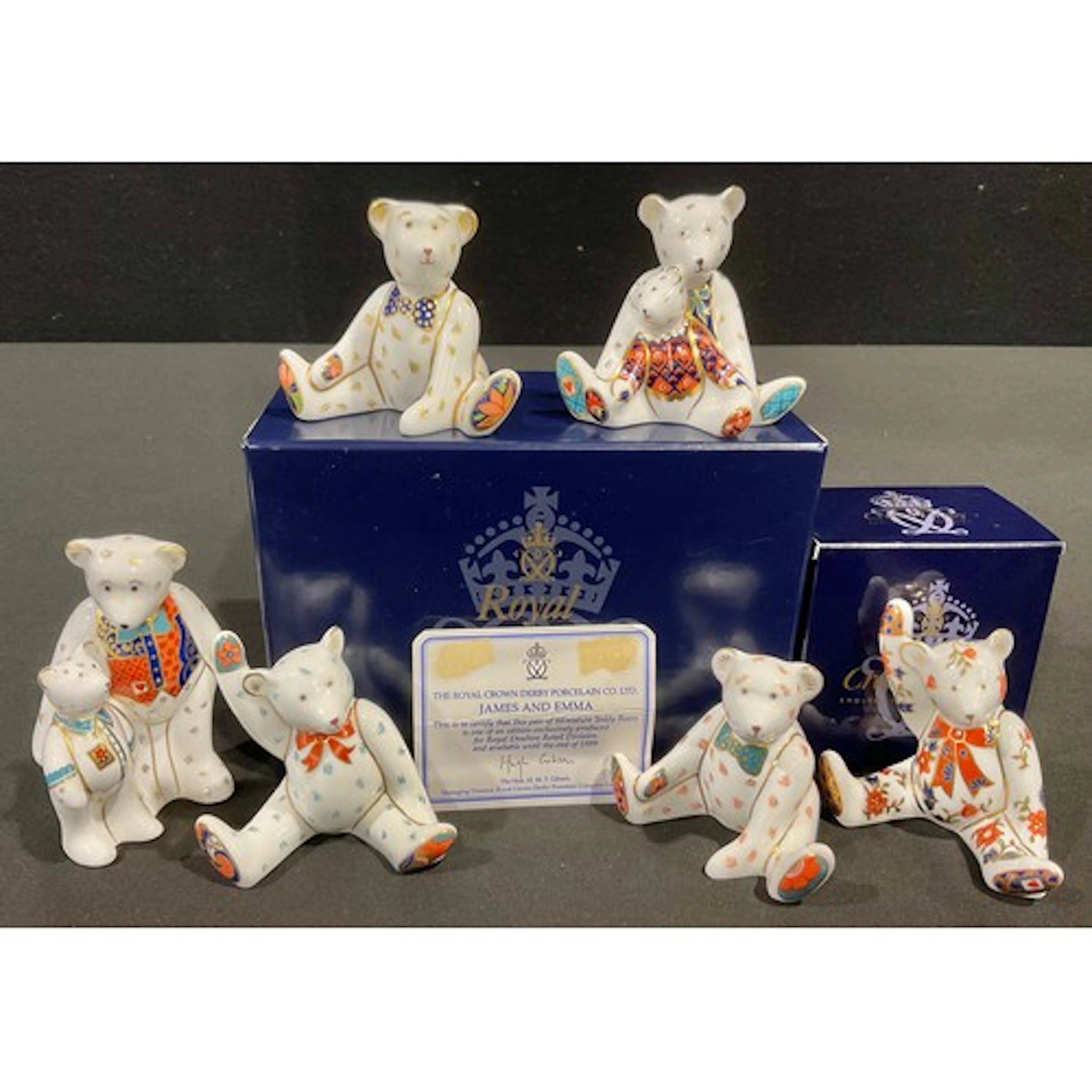 A Royal Crown Derby miniature teddy bear set, James and Emma...