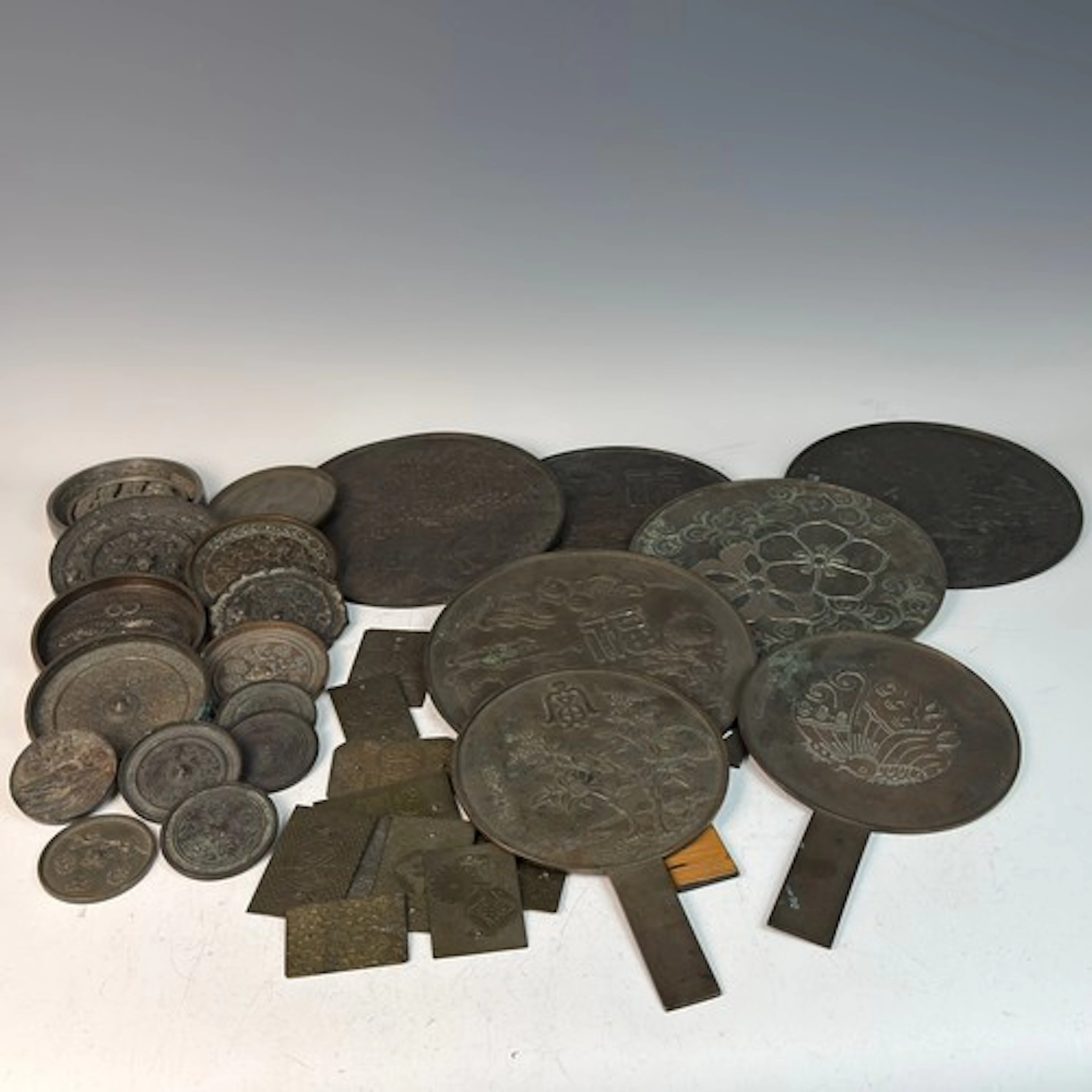 A collection of Japanese bronze 'Kagami' mirrors, Meiji/Tais...