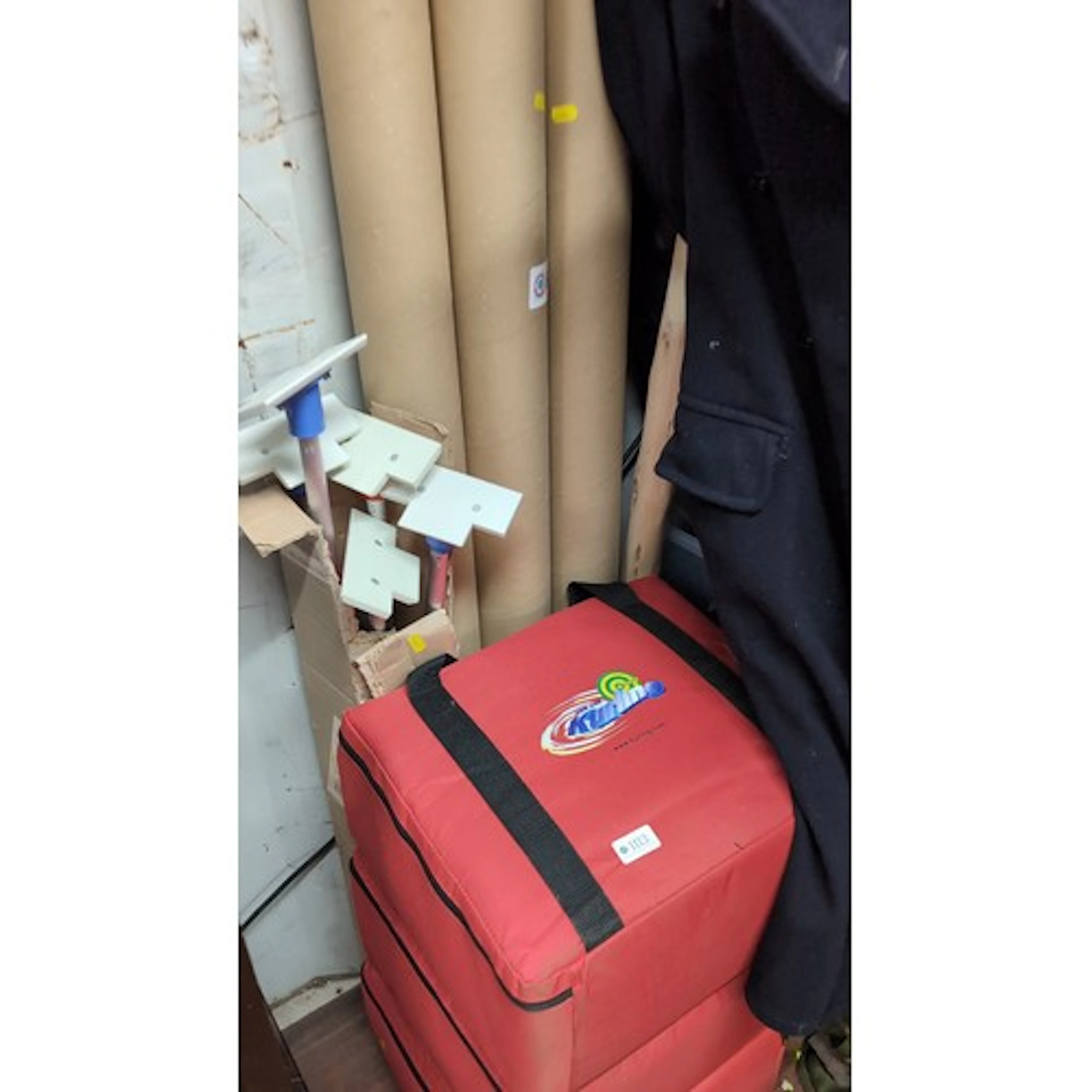 A group of New Age Kurling equipment, comprising a red padde...