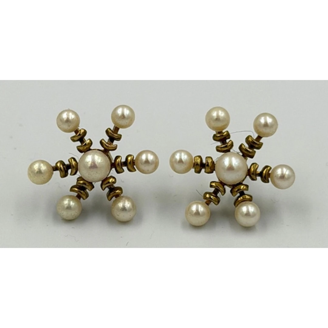 A pair of 9ct gold set pearl cluster earrings, approximate w...