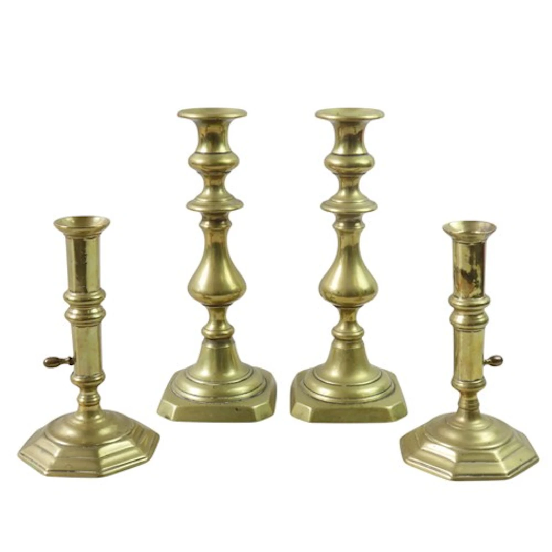 A PAIR OF 18TH CENTURY BRASS 'EJECTOR' CANDLESTICKS with fla...