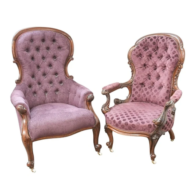 Two Victorian button back armchairs. The walnut example with...