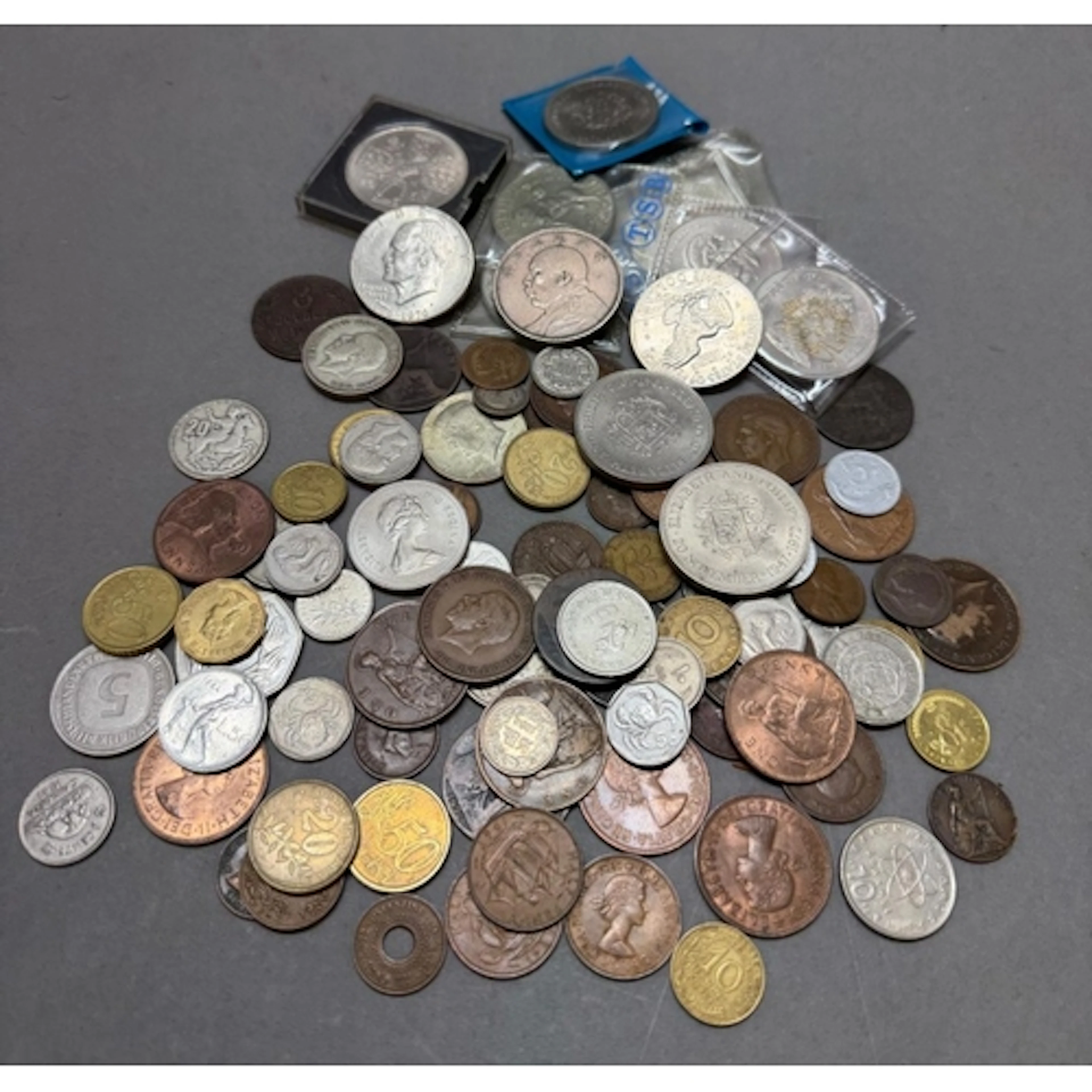 A selection of worldwide coins to include A China Fat Man do...