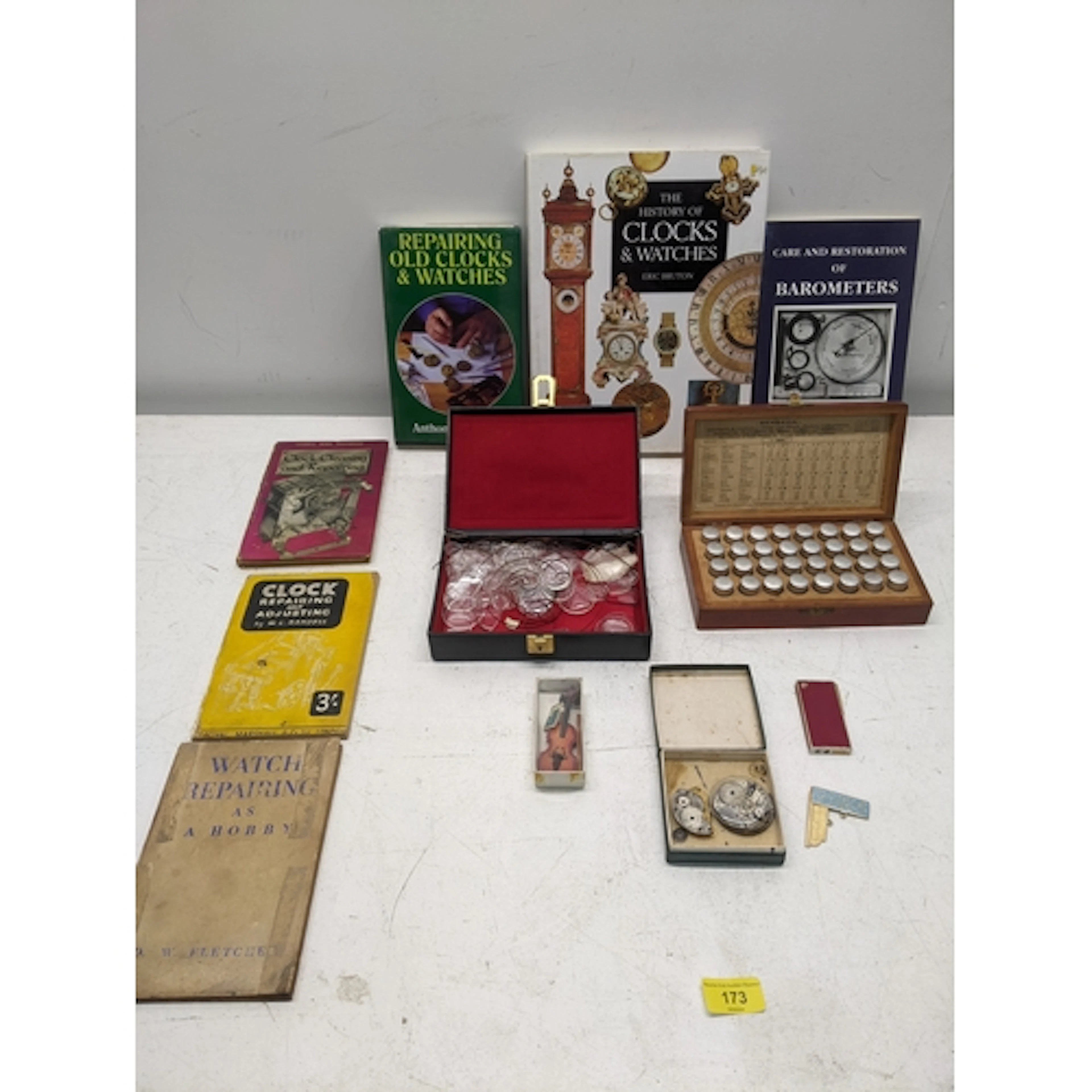 A lot of watch parts & tools for repairing watches & clocks,...