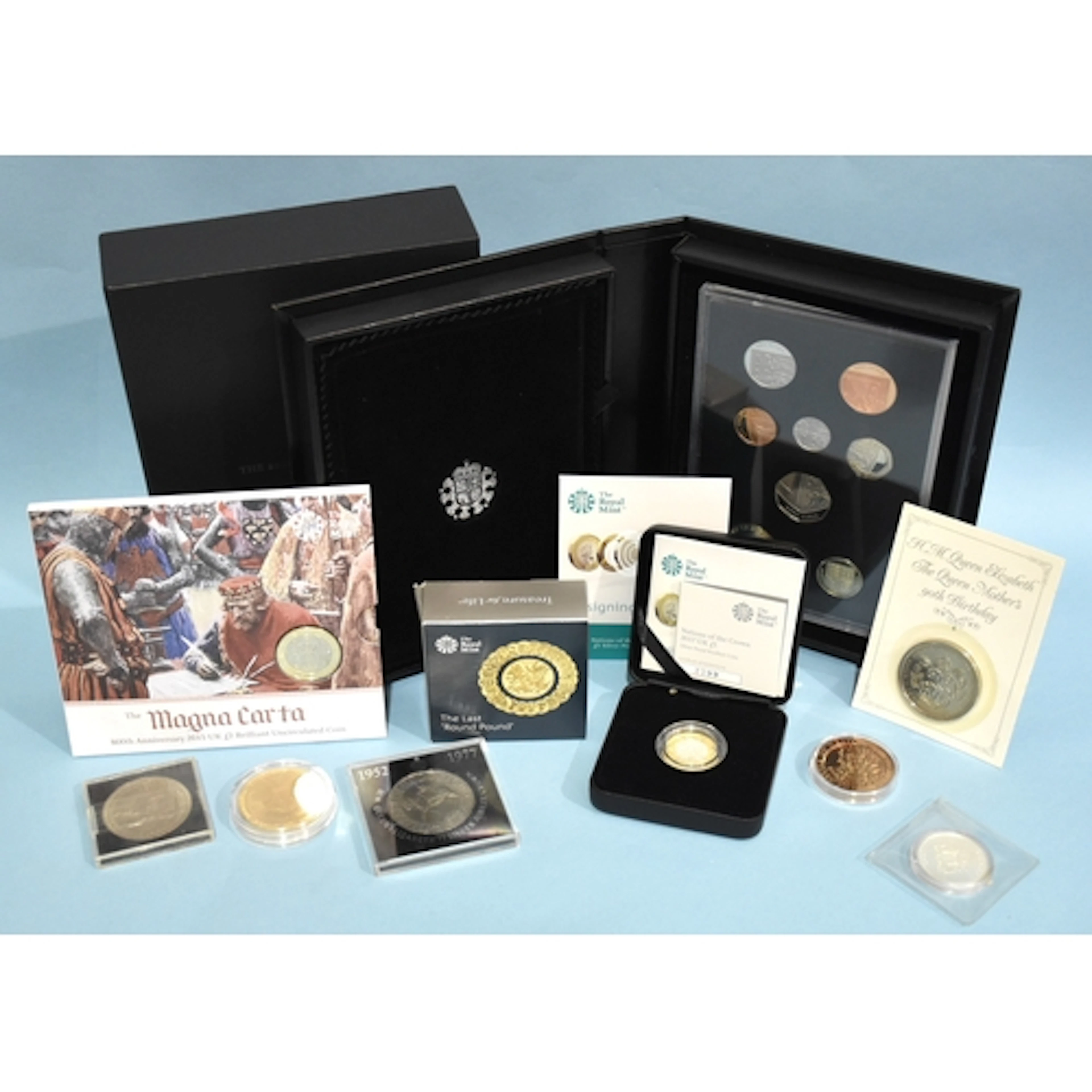 The Royal Mint, a 2015 UK base proof coin set, a 2016 The La...