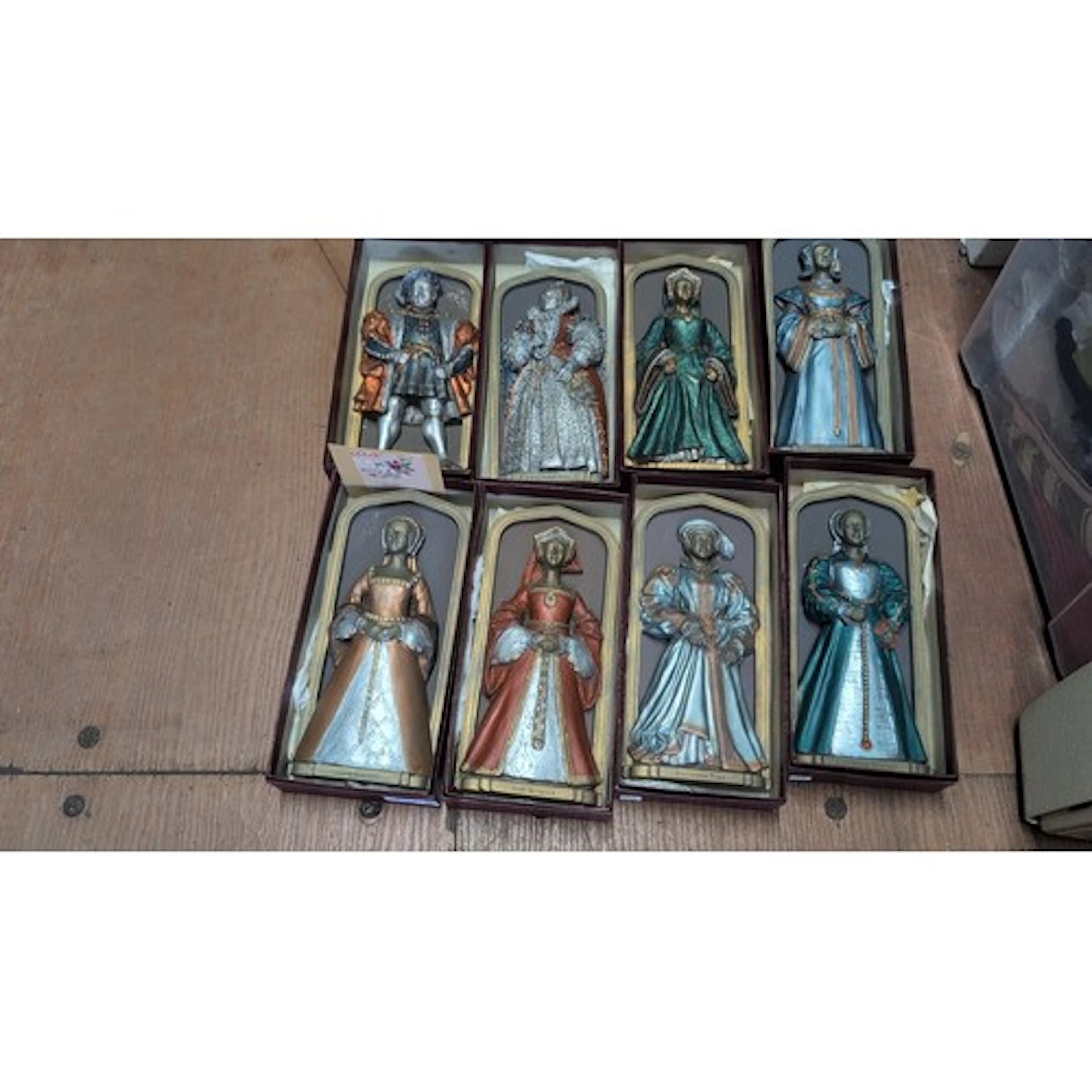 A set of painted relief plaques depicting Tudor monarchs and...