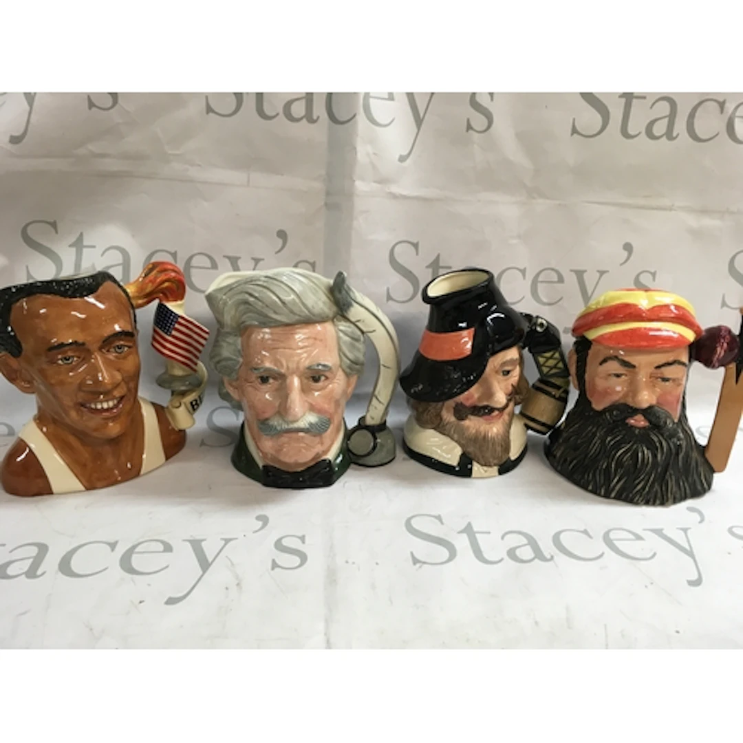 A collection of 4 Doulton character jugs including Jesse Owe...