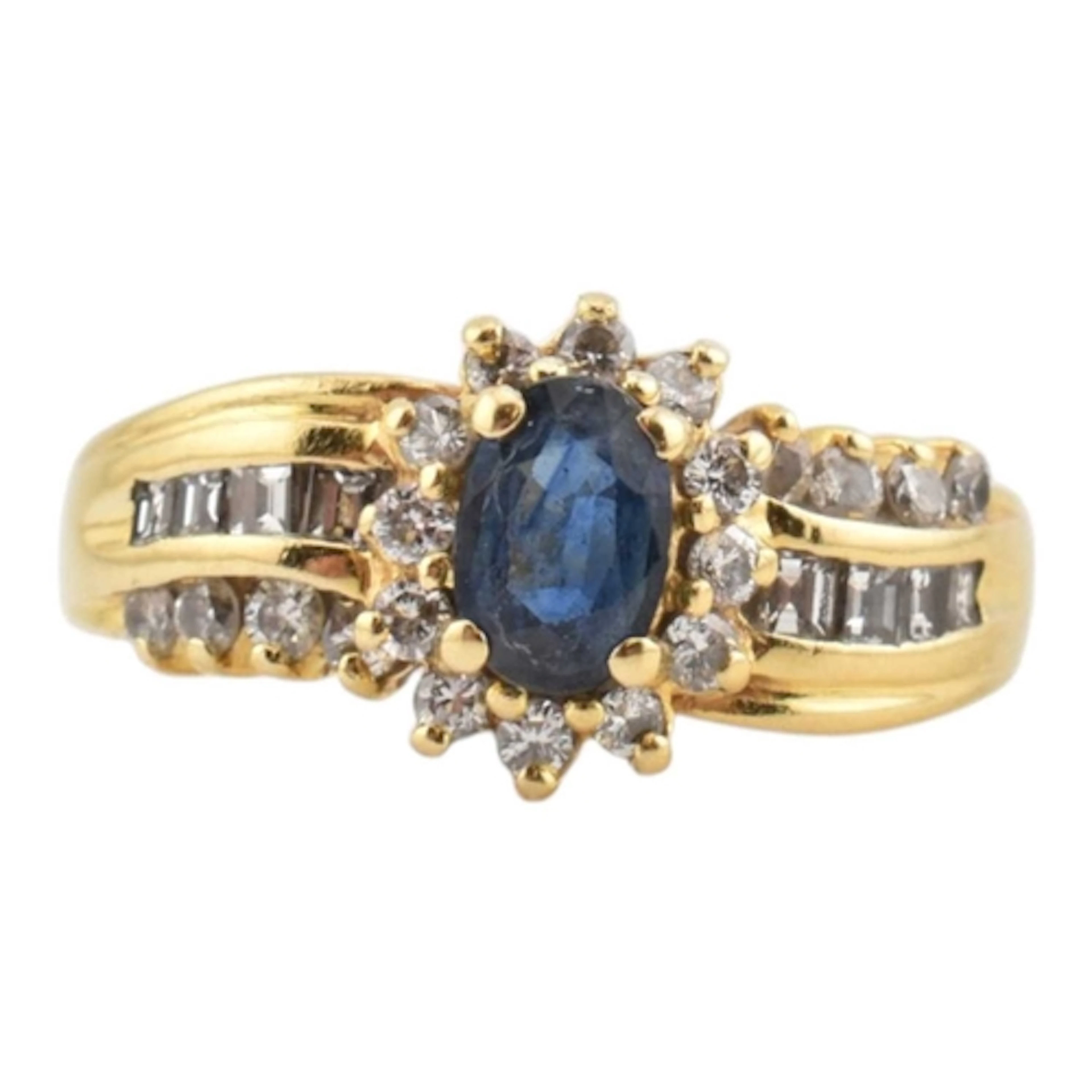 A 1980s 18ct gold, sapphire and diamond ring. Oval sapphire ...