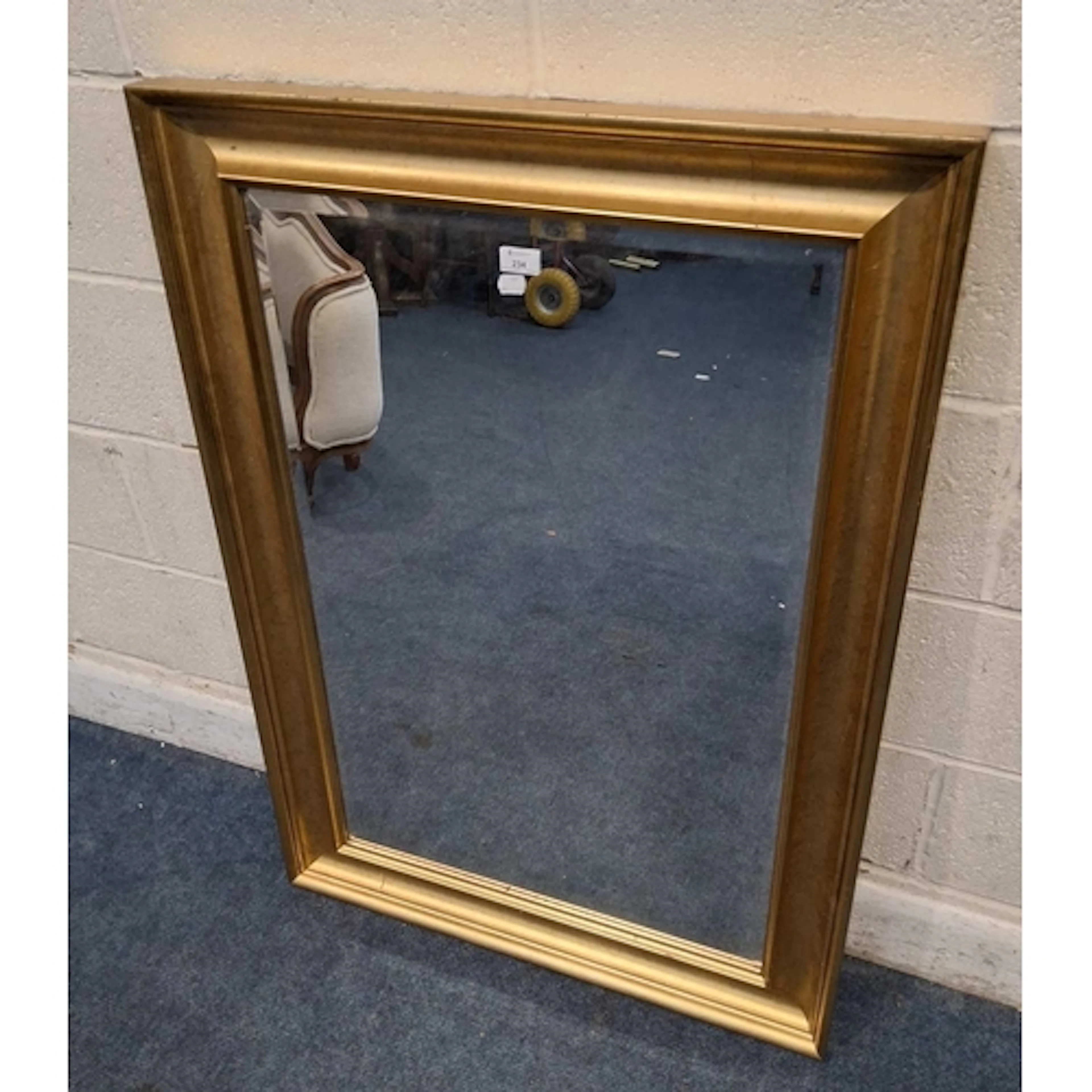 A GILT WOOD RECTANGULAR BEVELLED EDGE WALL MIRROR (109cm x ...