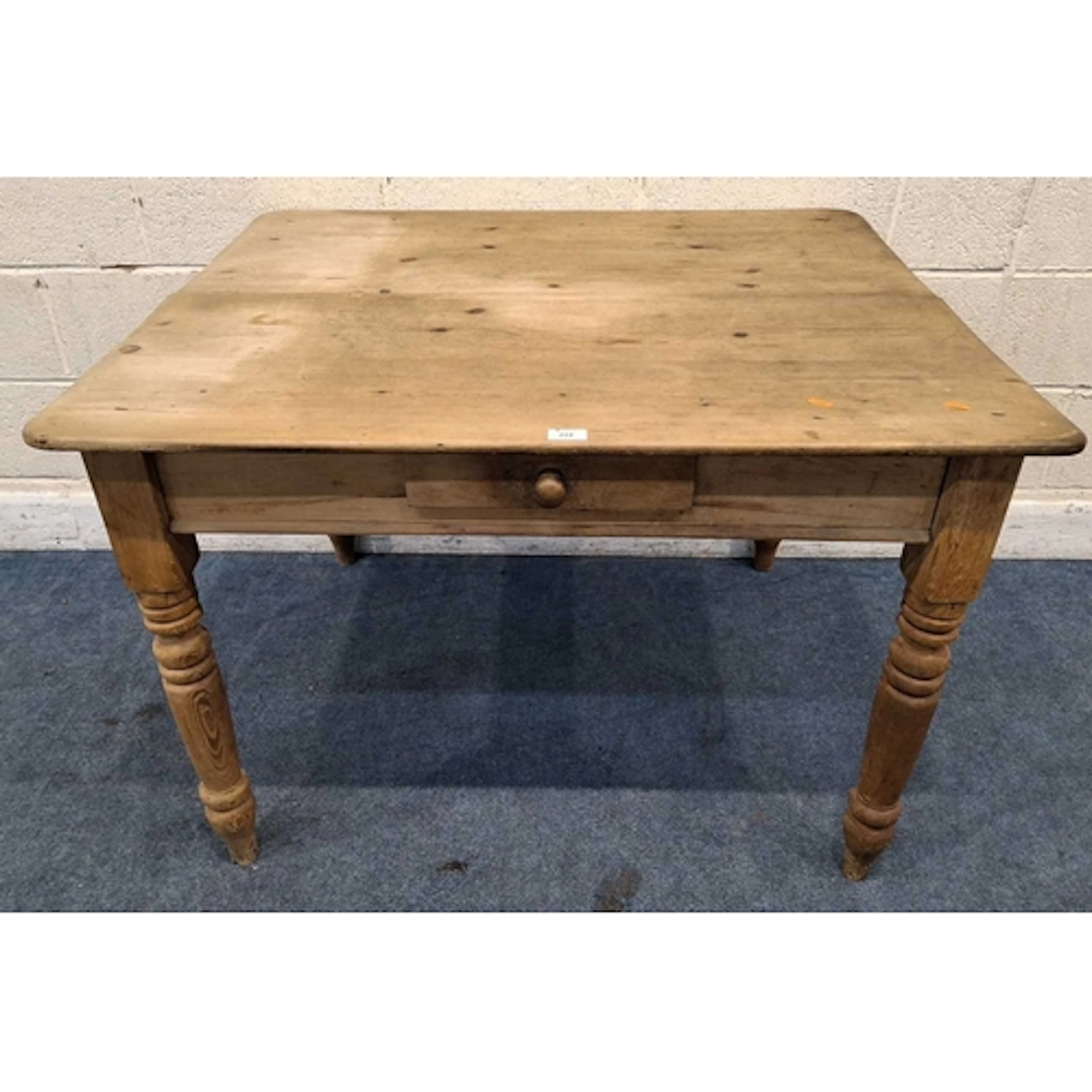 A 19TH CENTURY PINE KITCHEN TABLE, with a single frieze draw...