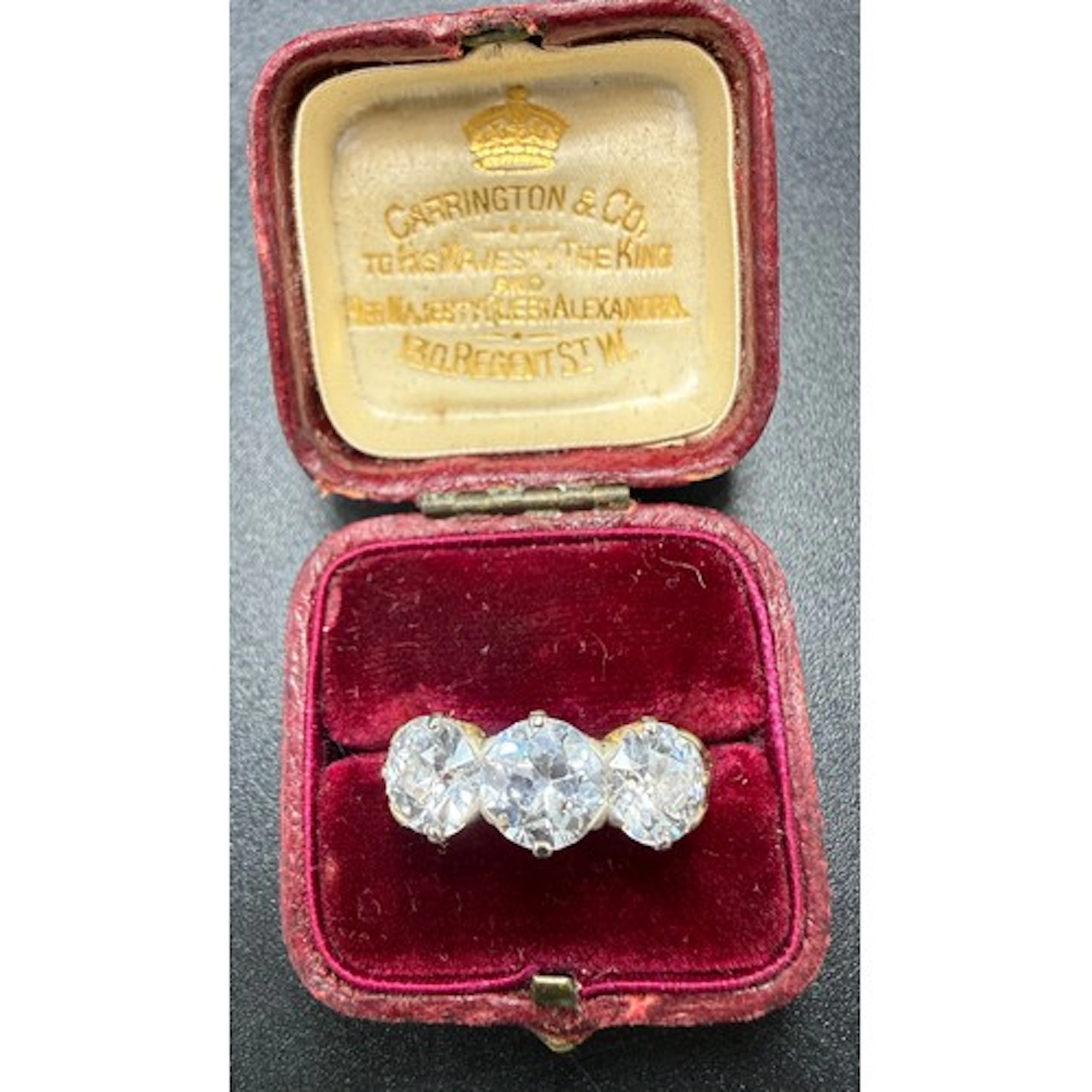 A three stone diamond ring set in yellow gold. Old cut diamo...