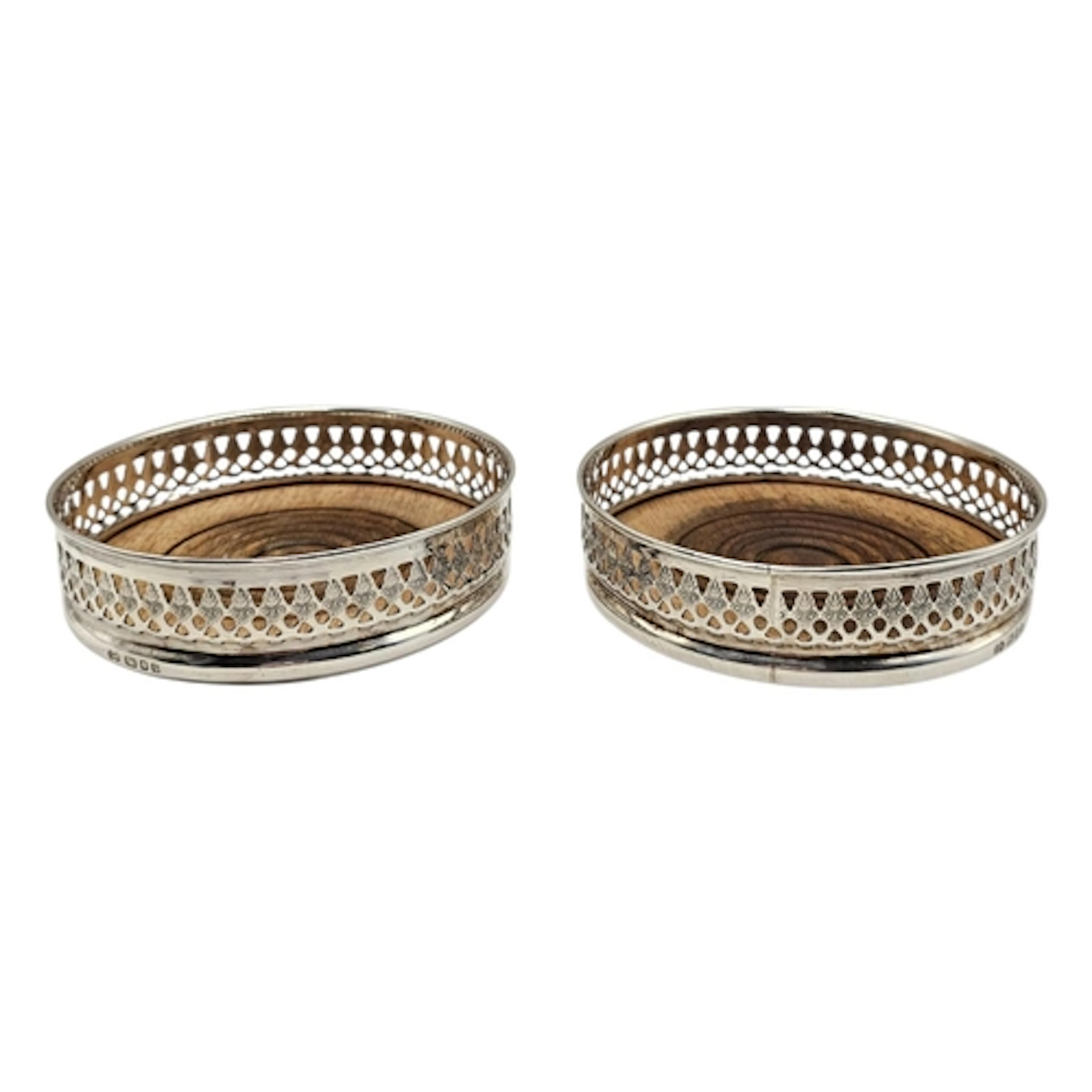 A PAIR OF VINTAGE SILVER WINE COASTERS Having a pierced gall...