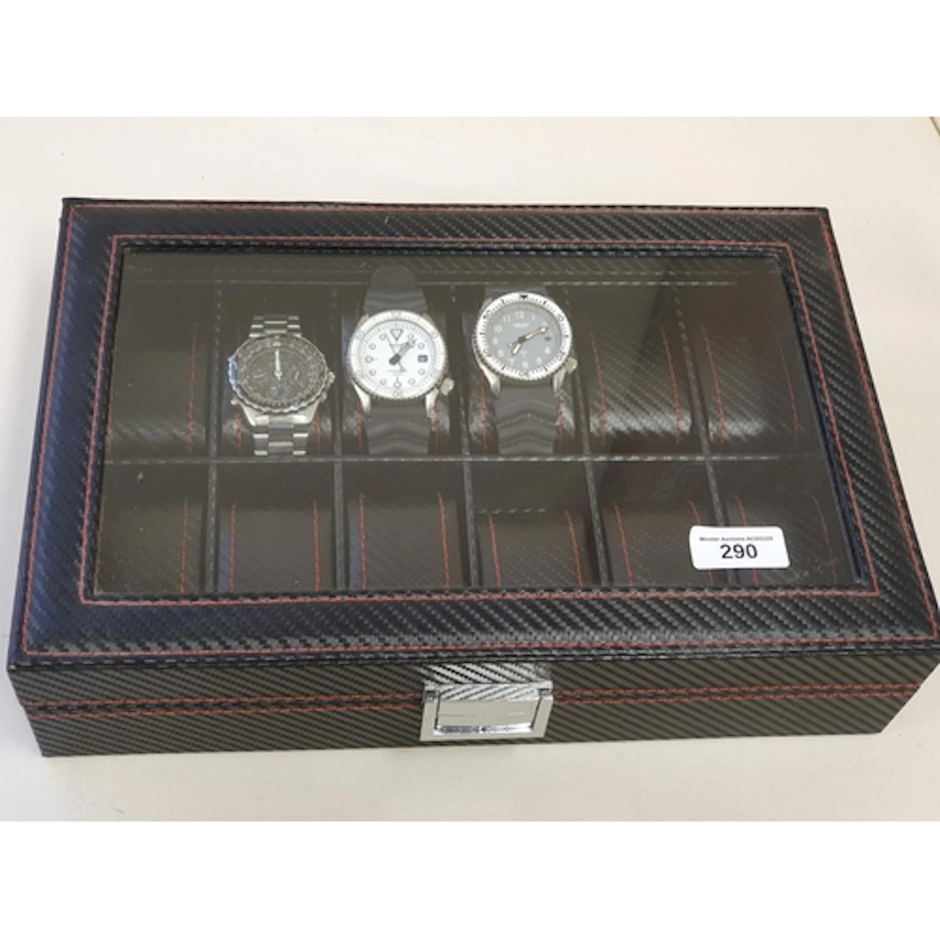 A Watch Display Case containing three gentleman's Wristwatch...