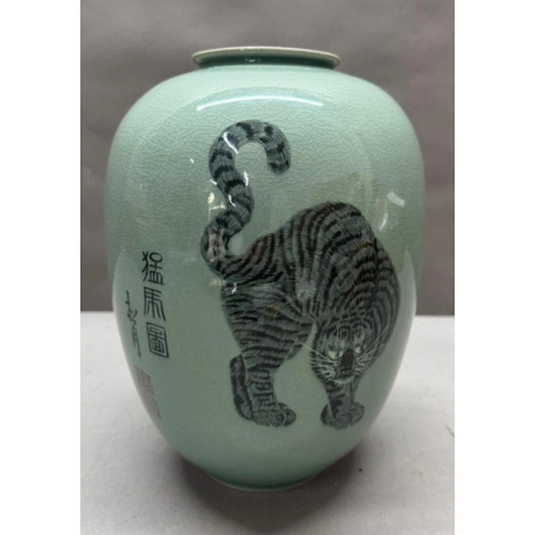 A Korean celadon crackle glaze vase decorated withi a tiger ...