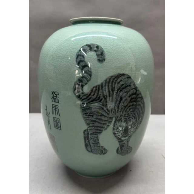 A Korean celadon crackle glaze vase decorated withi a tiger ...
