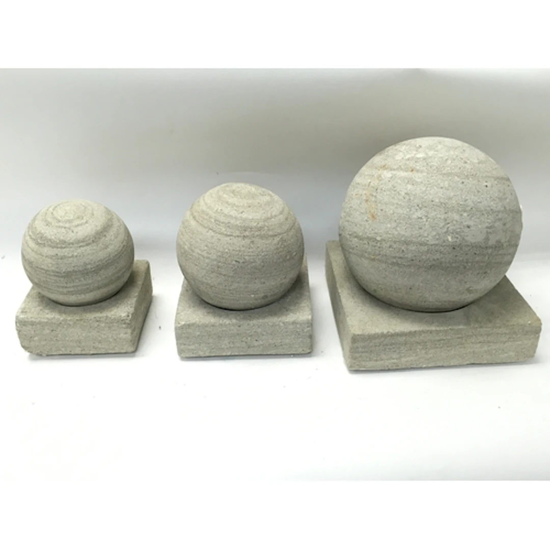 Three stone balls and plinths tallest Approx 23cm