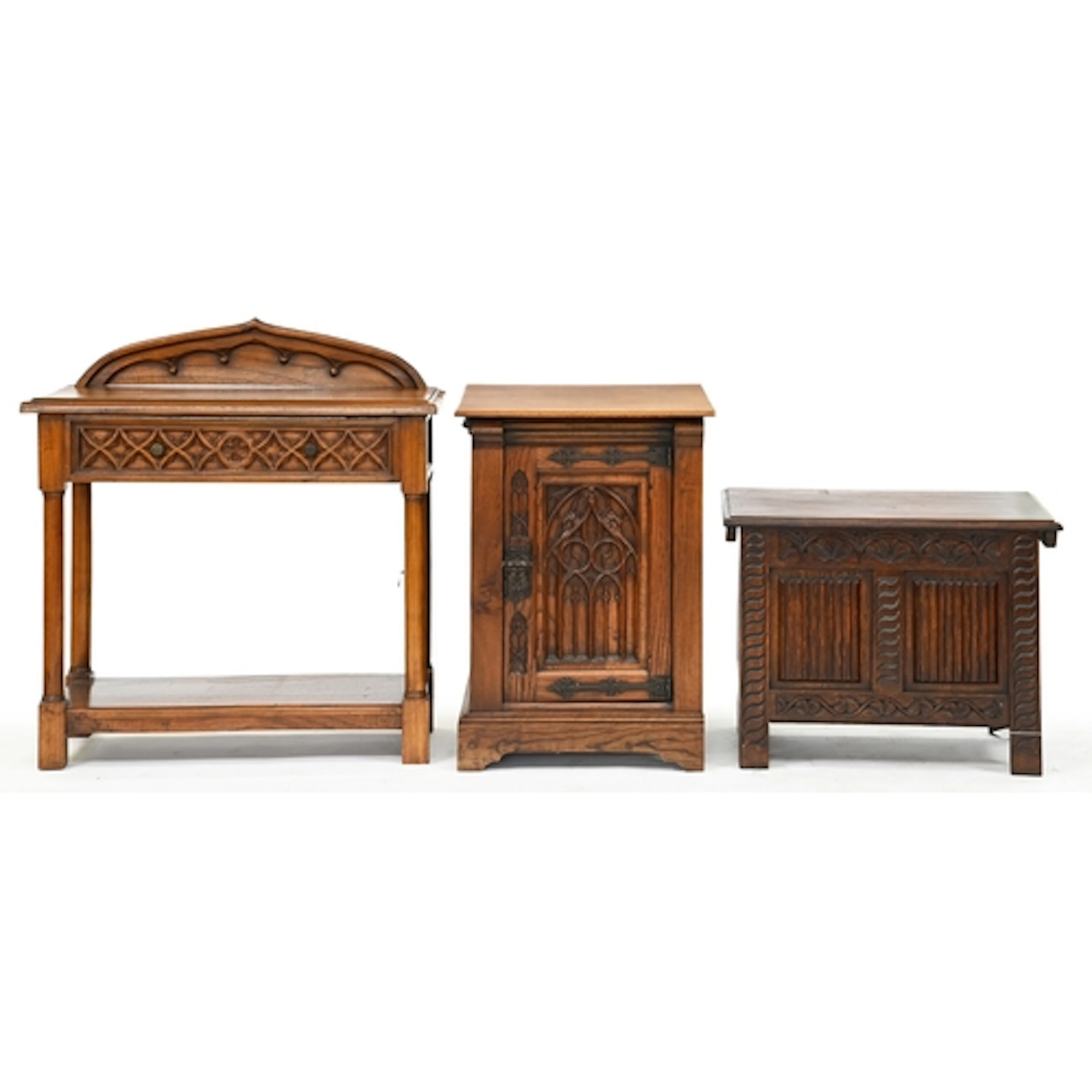 A gothic oak side table and pedestal-cupboard, late 20th c, ...