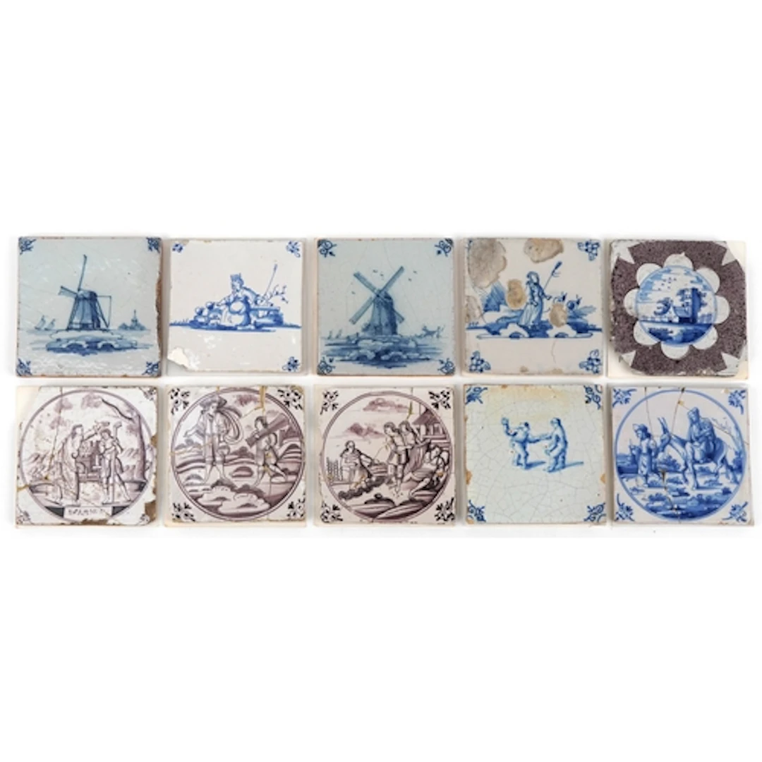 Ten 18th century Dutch pottery tiles hand painted in blue an...
