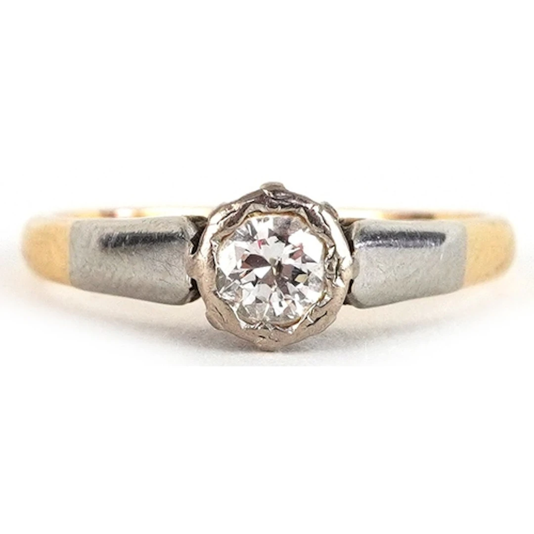 18ct gold and platinum diamond solitaire ring, the diamond a...