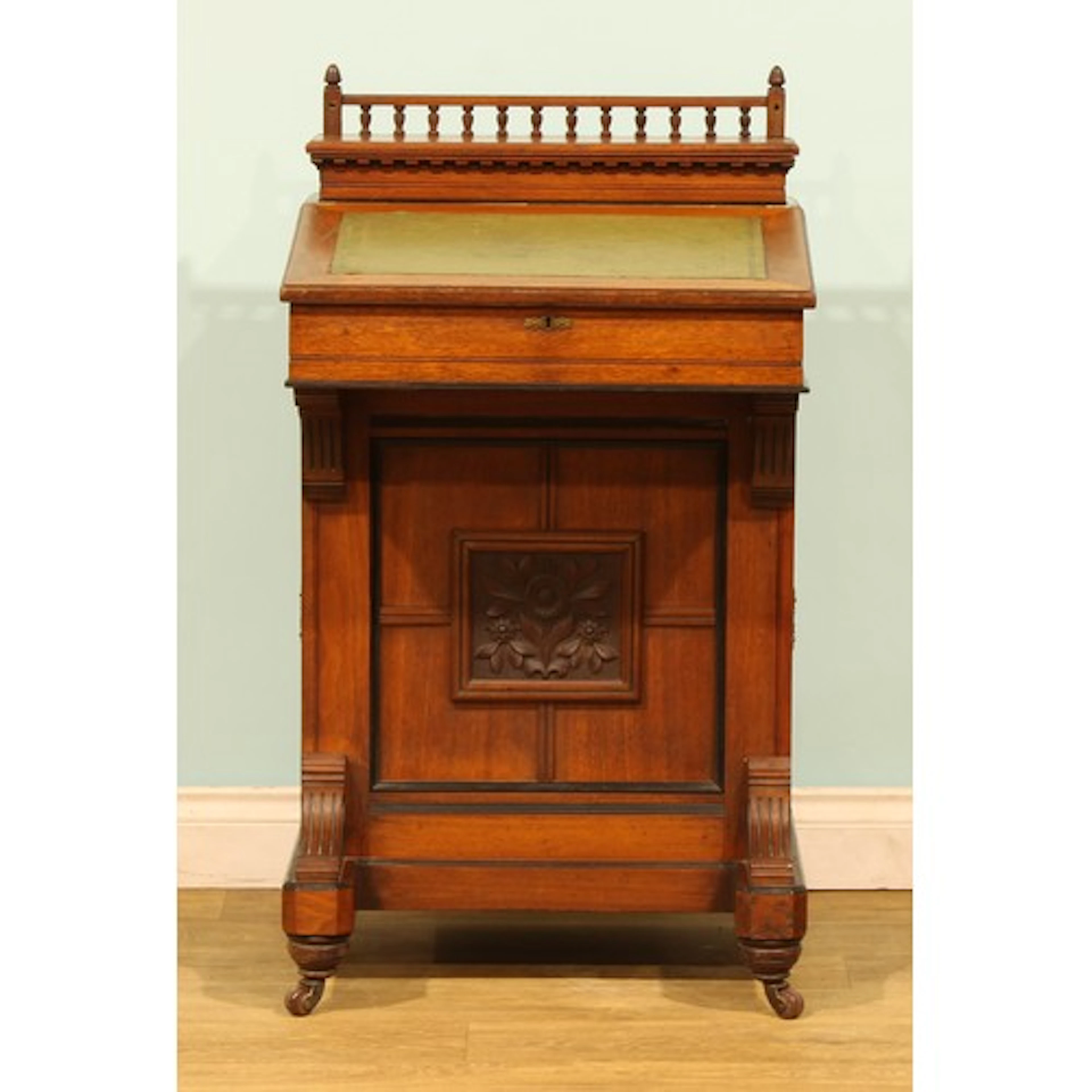 An Aesthetic Movement walnut and mahogany Davenport, galleri...