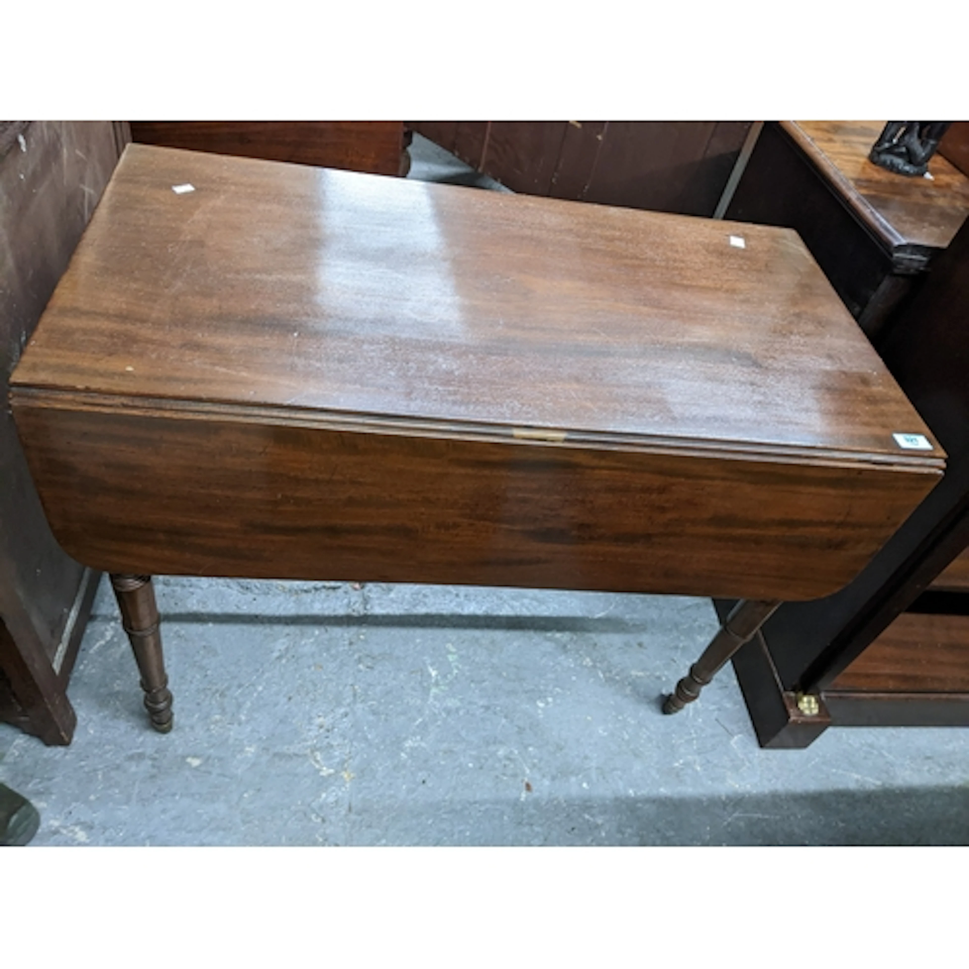 A late Victorian mahogany drop flap Pembroke table, with sin...