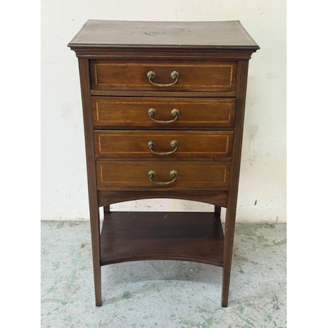 A mahogany inlaid four drawer music cabinet by Gullachsens. ...