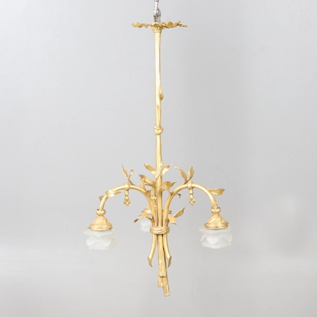 A FRENCH GILT METAL THREE BRANCH CEILING LIGHT. the central ...