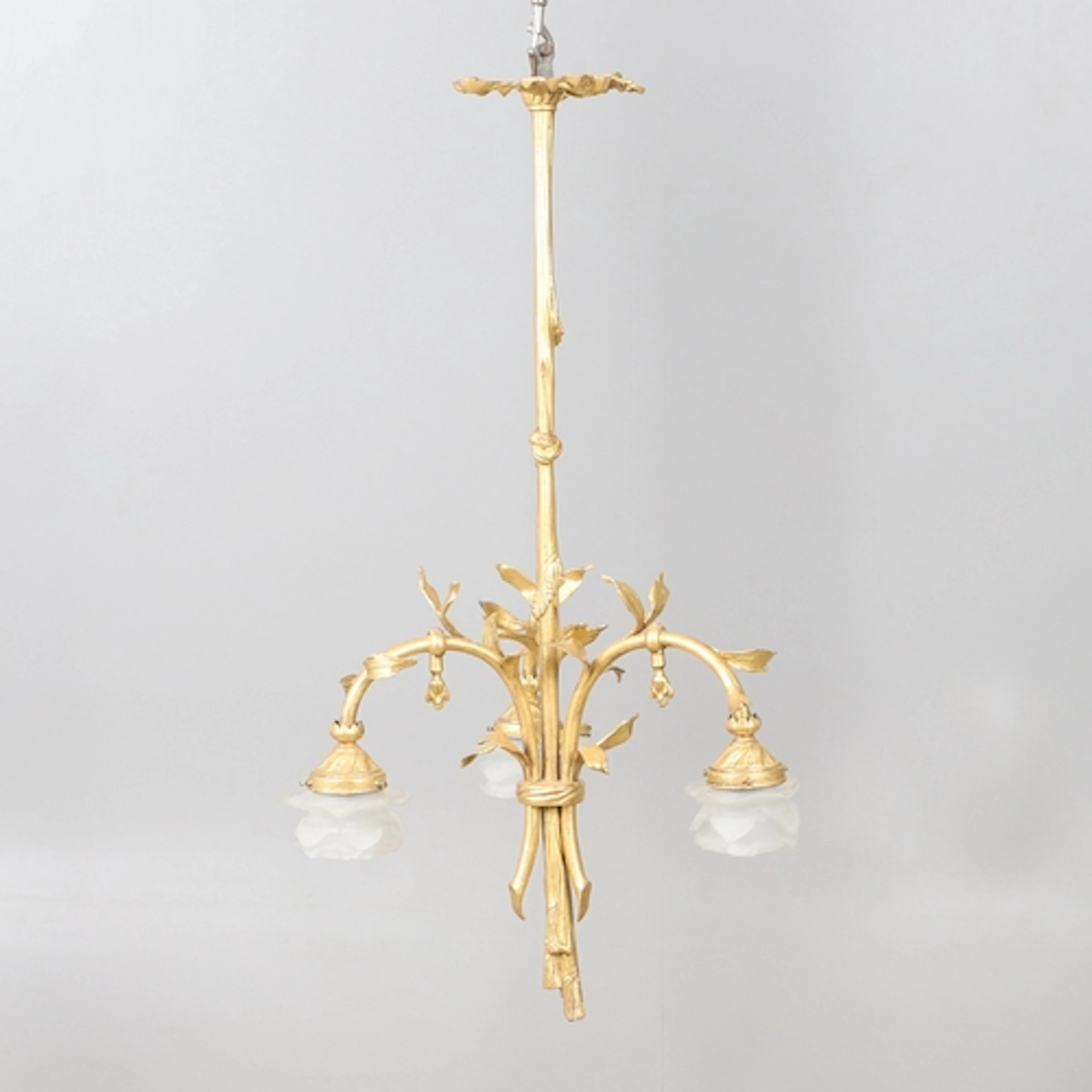 A FRENCH GILT METAL THREE BRANCH CEILING LIGHT. the central ...
