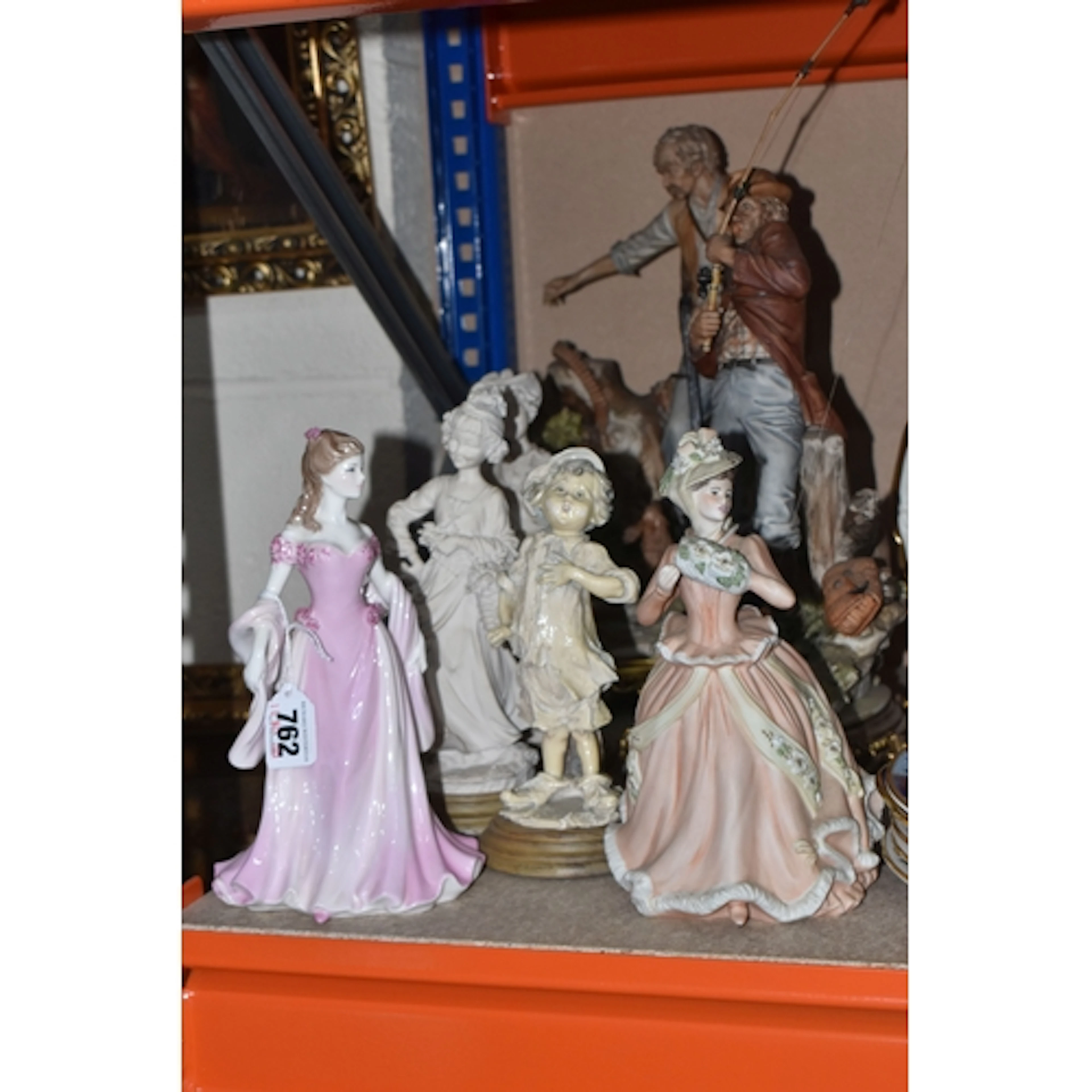 A GROUP SEVEN FIGURINES, comprising Capodimonte figurines co...