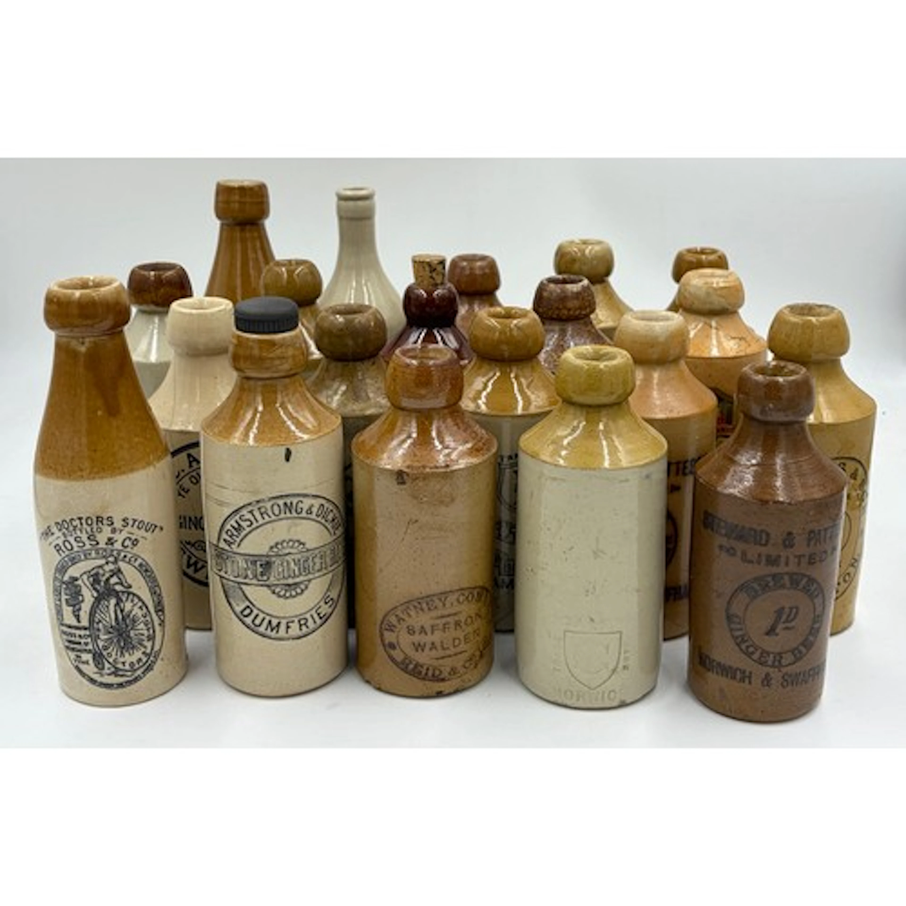 Collection of stoneware ginger beer bottles Ross & Co (Newca...