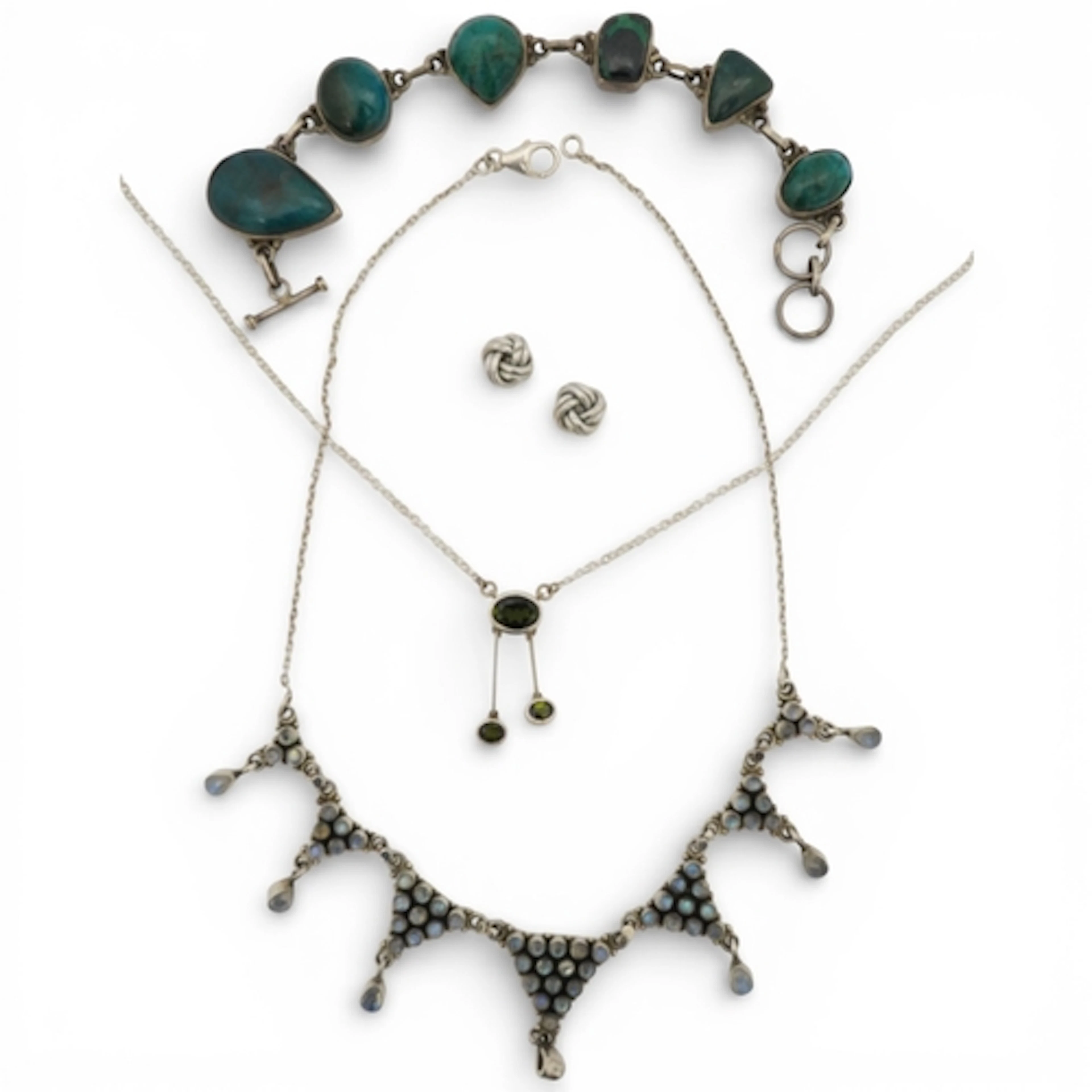 A collection of silver jewels, comprising: a bracelet set wi...