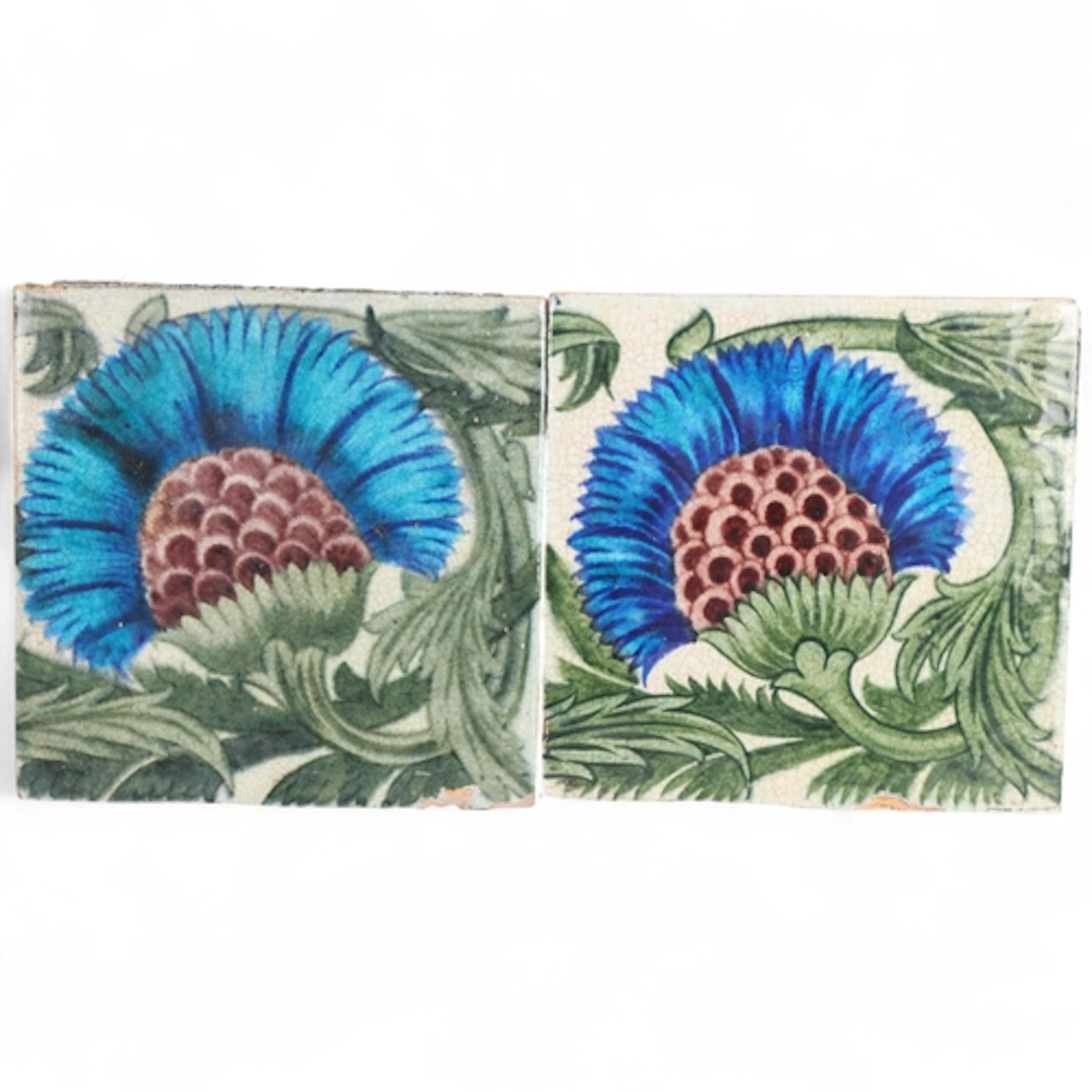 A pair of William De Morgan tiles, Persian inspired flower a...