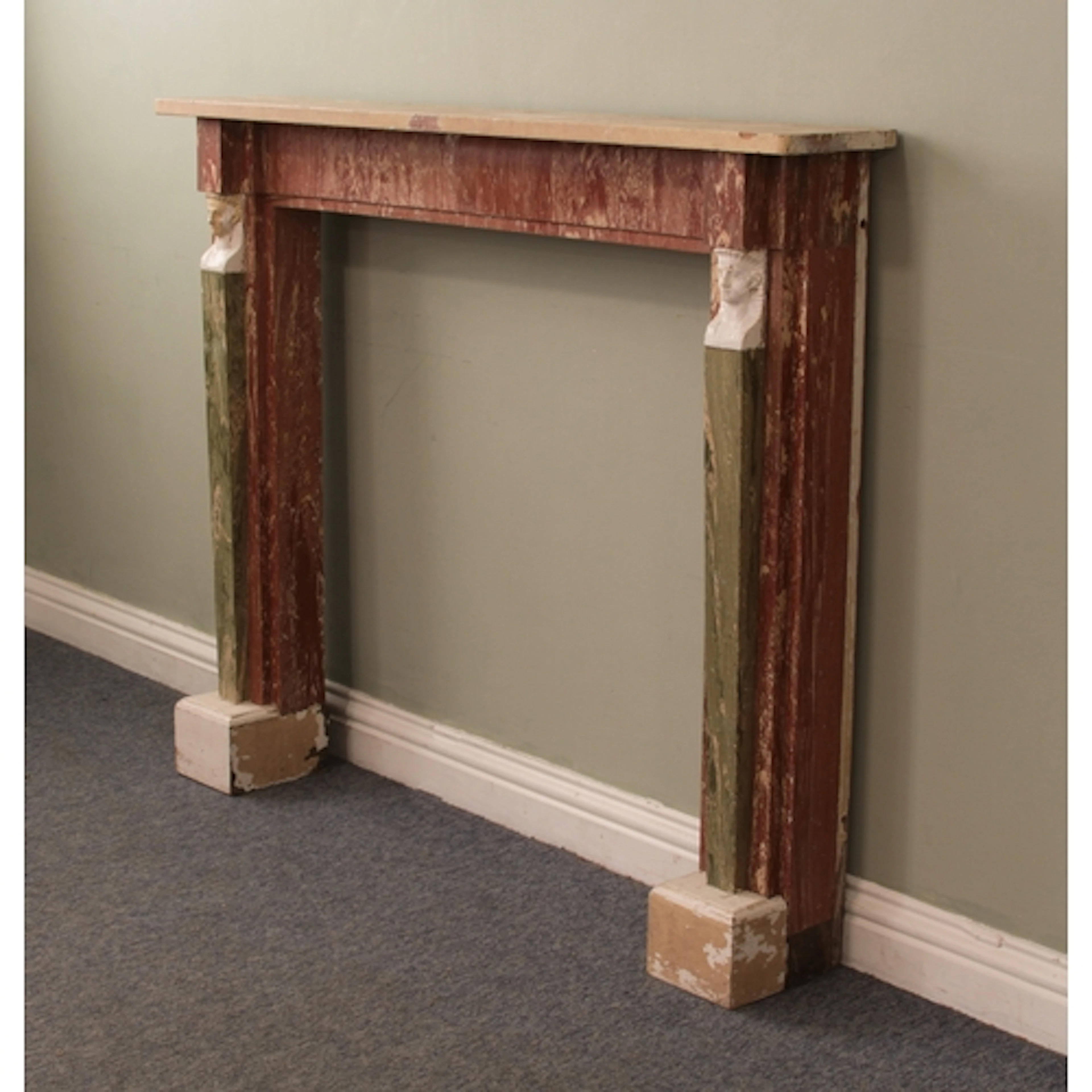 A Regency carved and simulated-marble painted pine chimneypi...