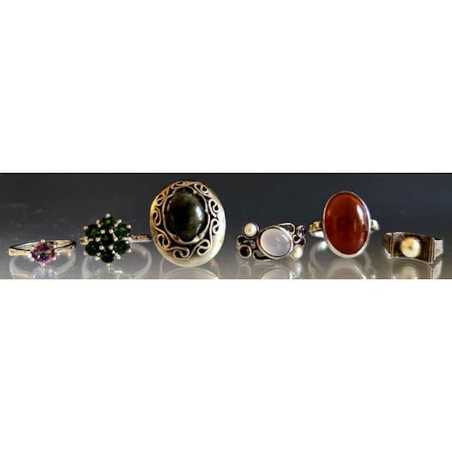 Six silver rings, to include an unmarked white metal green o...