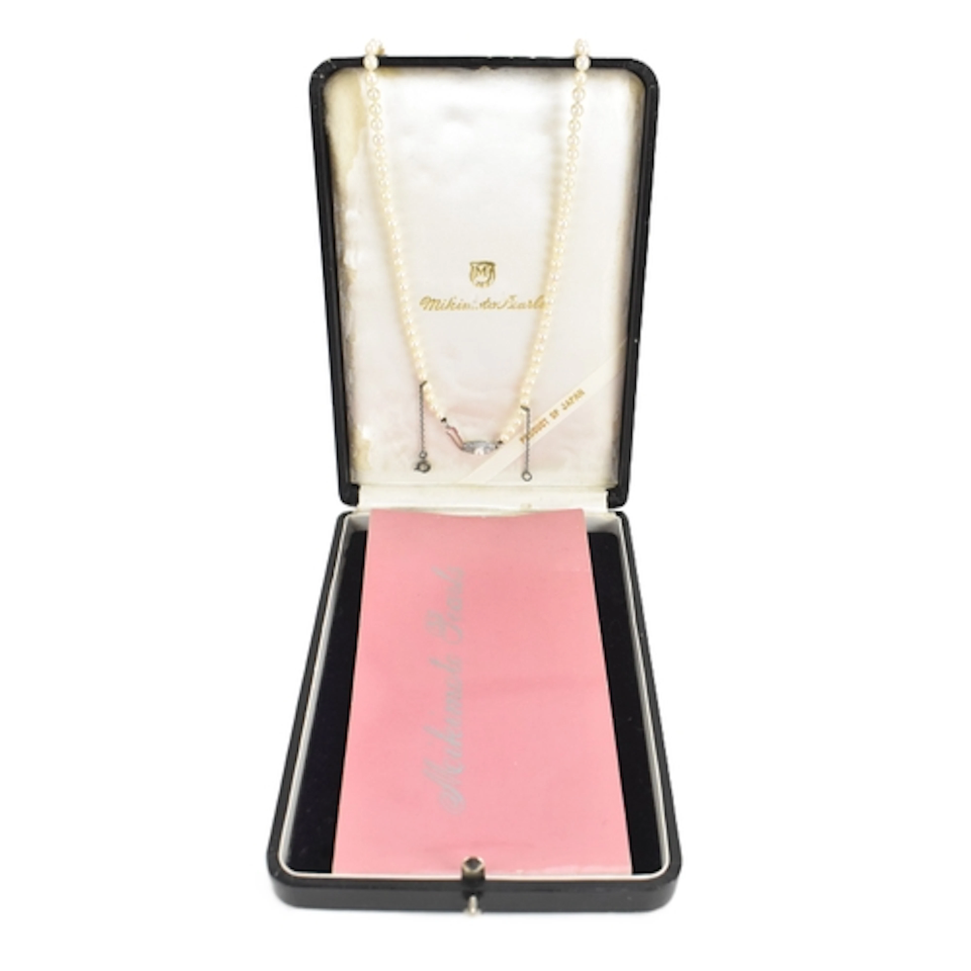 A Mikimoto single strand pearl necklace, having graduating p...