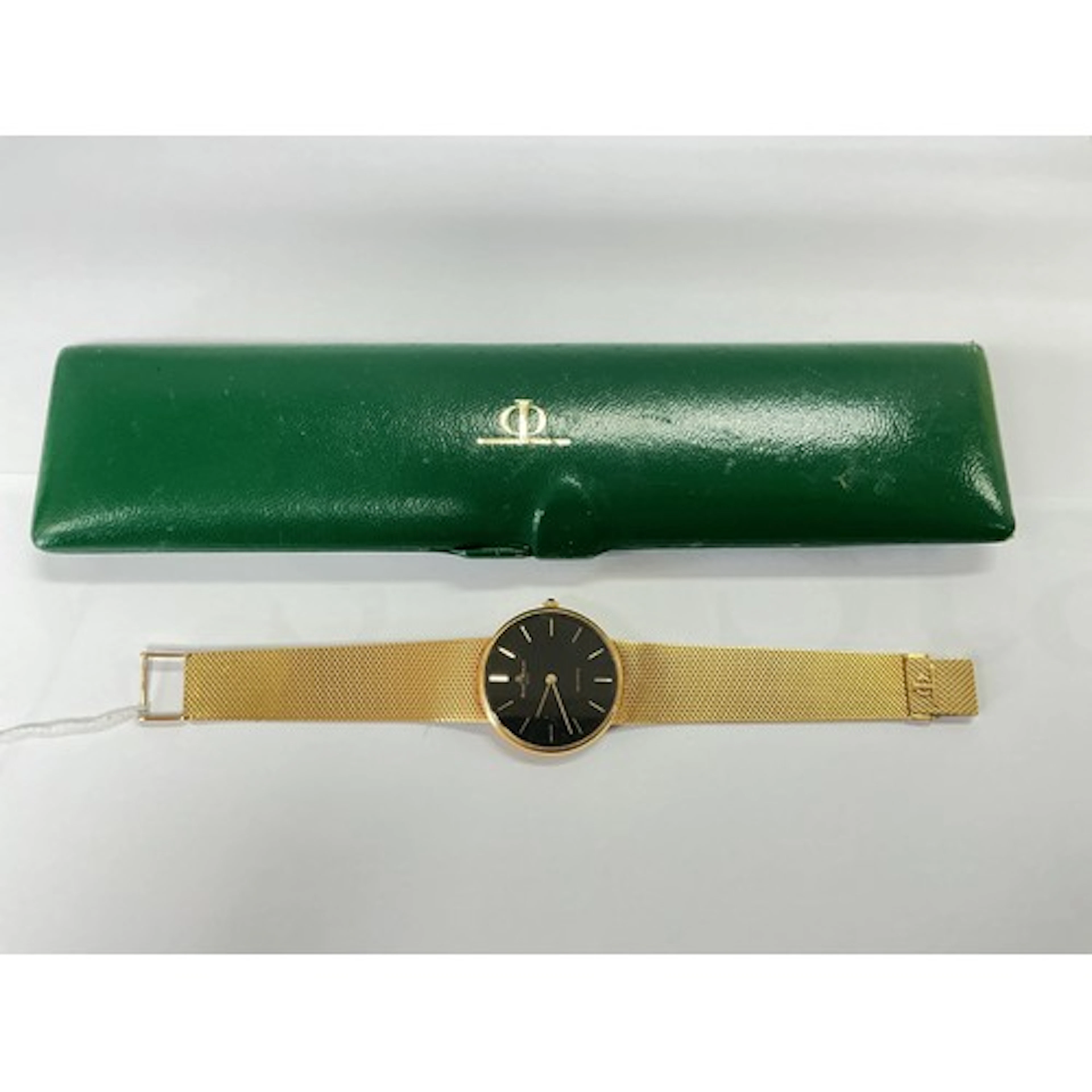 An 18ct gold Baume & Mercier watch with black dial and b...