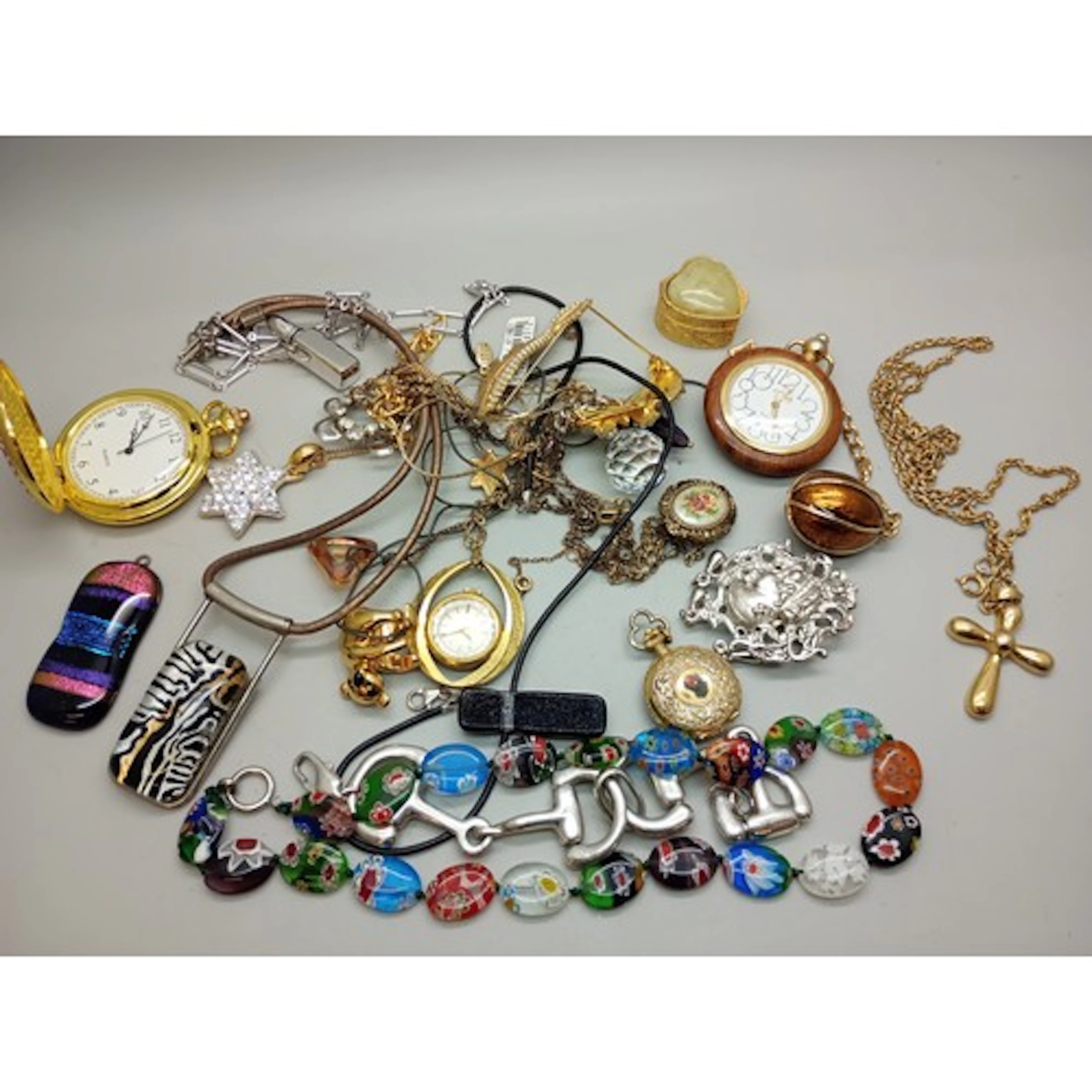 A collection of costume jewellery and pendant watches, inclu...
