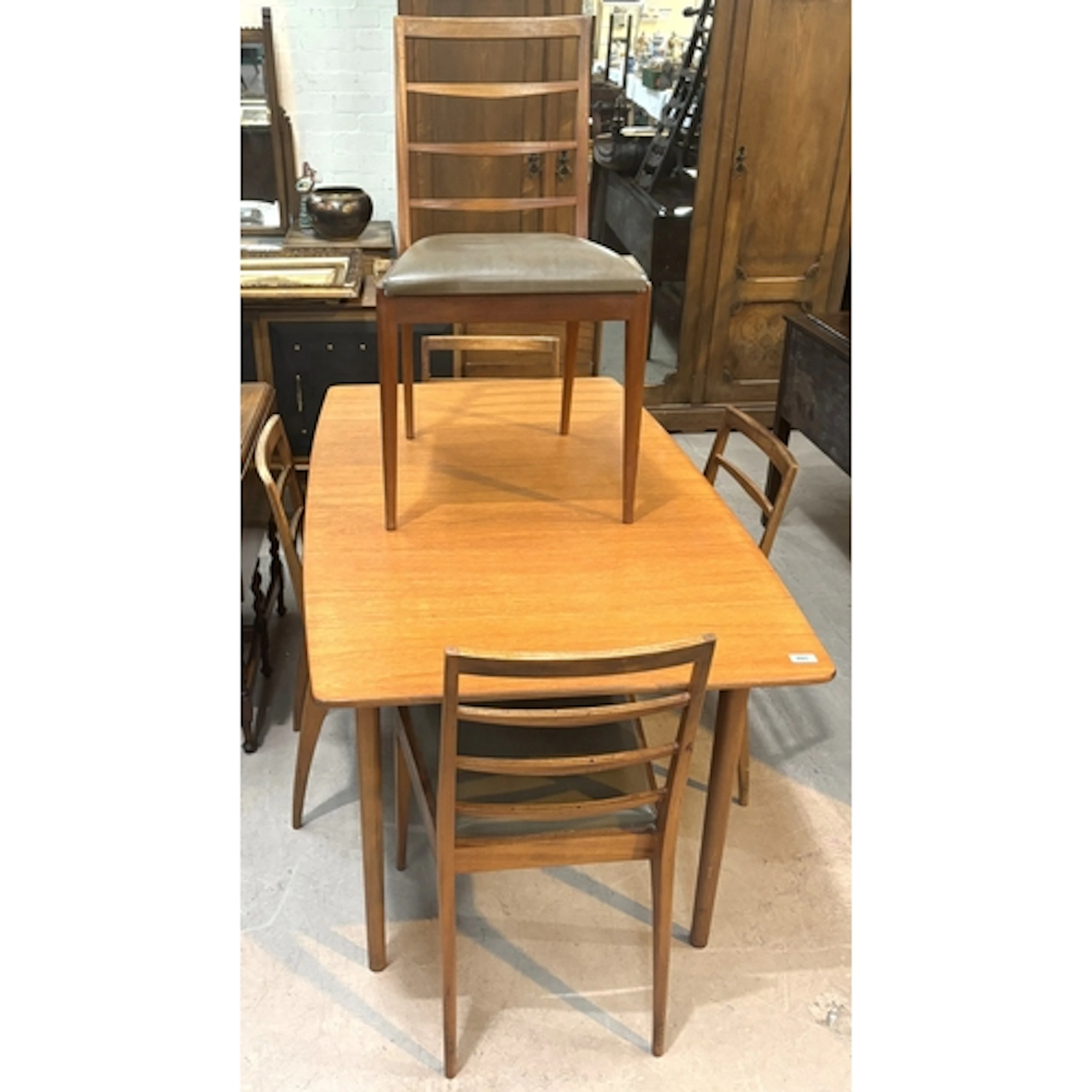 McIntosh mid century teak dining suite comprising of an exte...