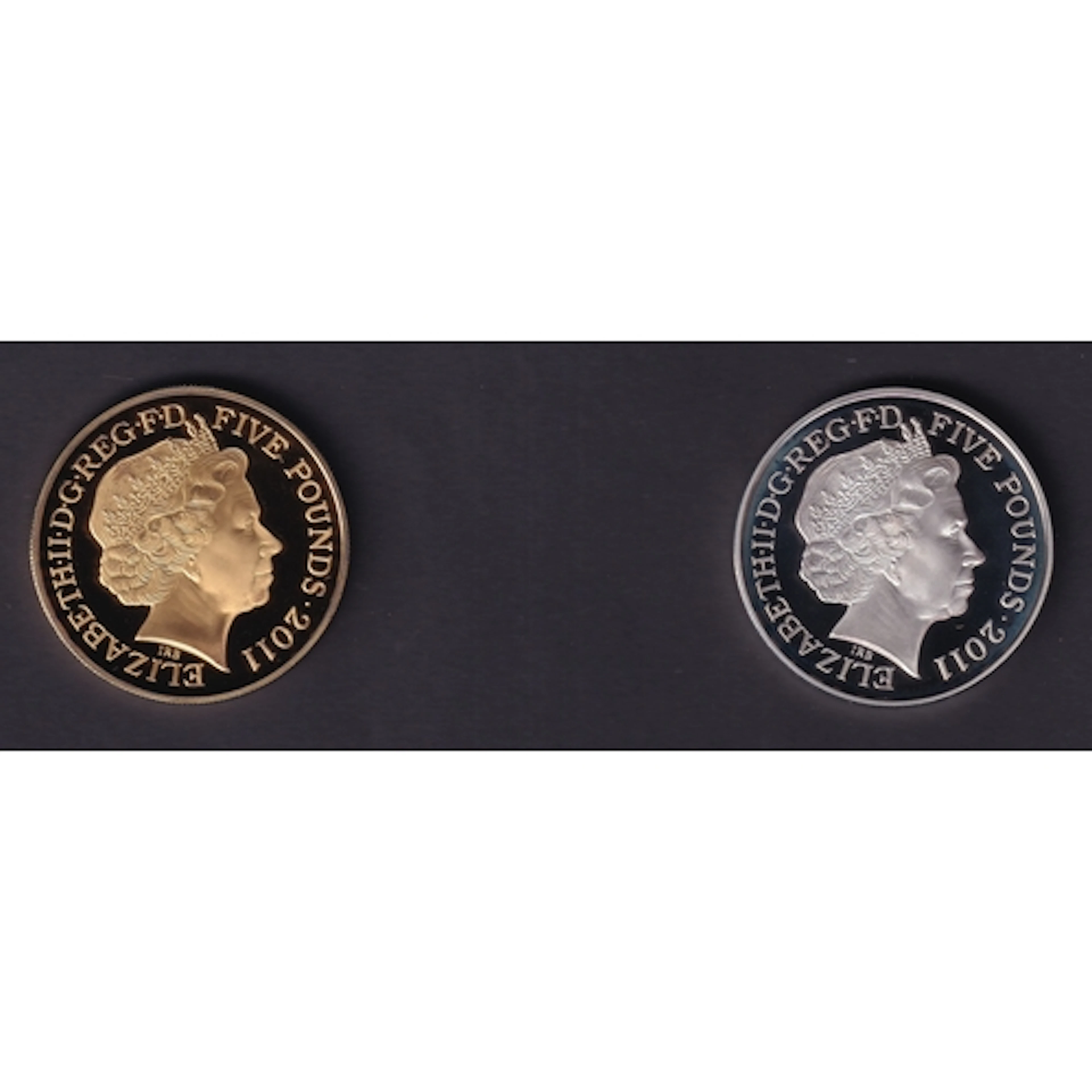 A group of four UK Queen Elizabeth II silver proof £5 coins,...