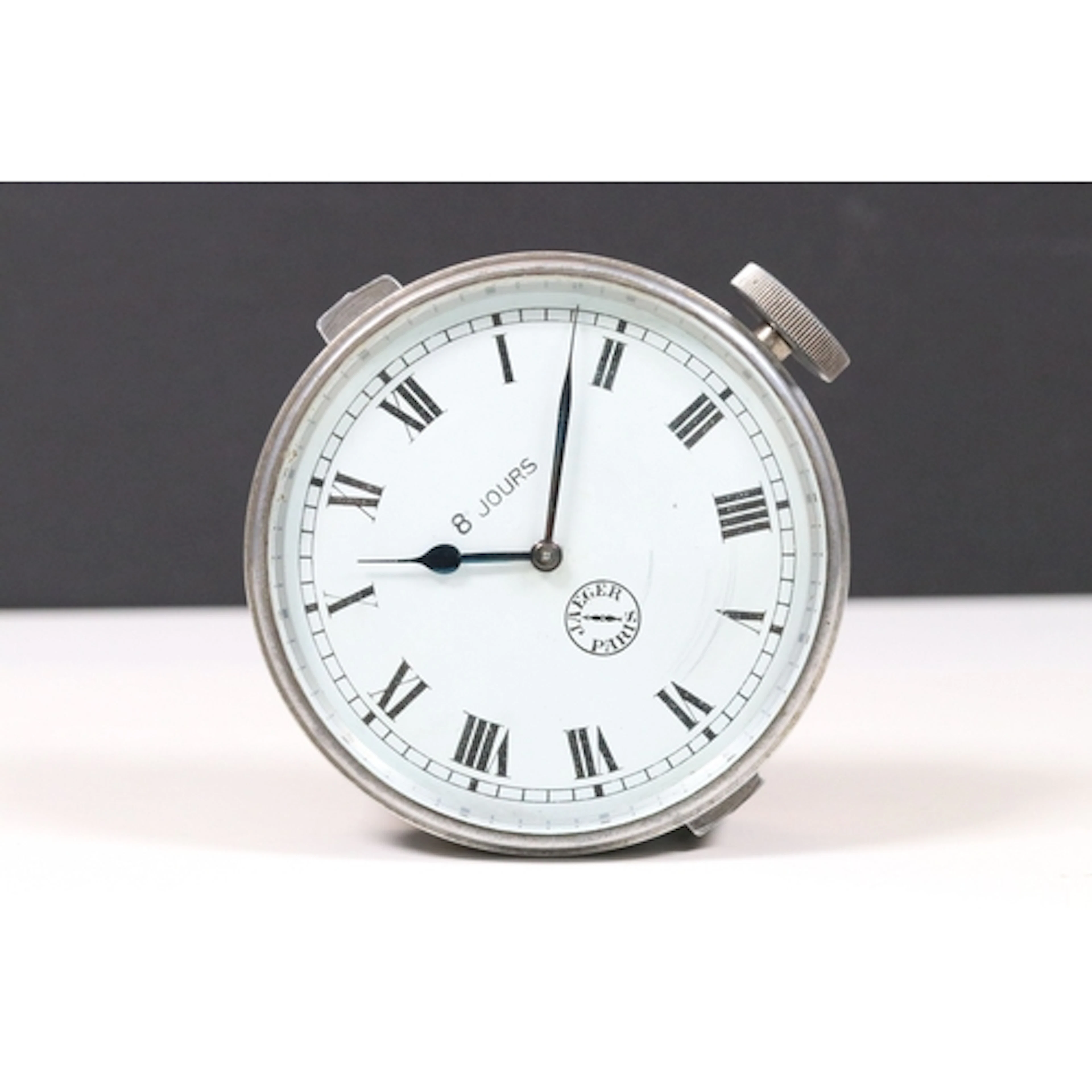 Jaeger 8-day car clock, the roman numeric dial marked Jaeger...