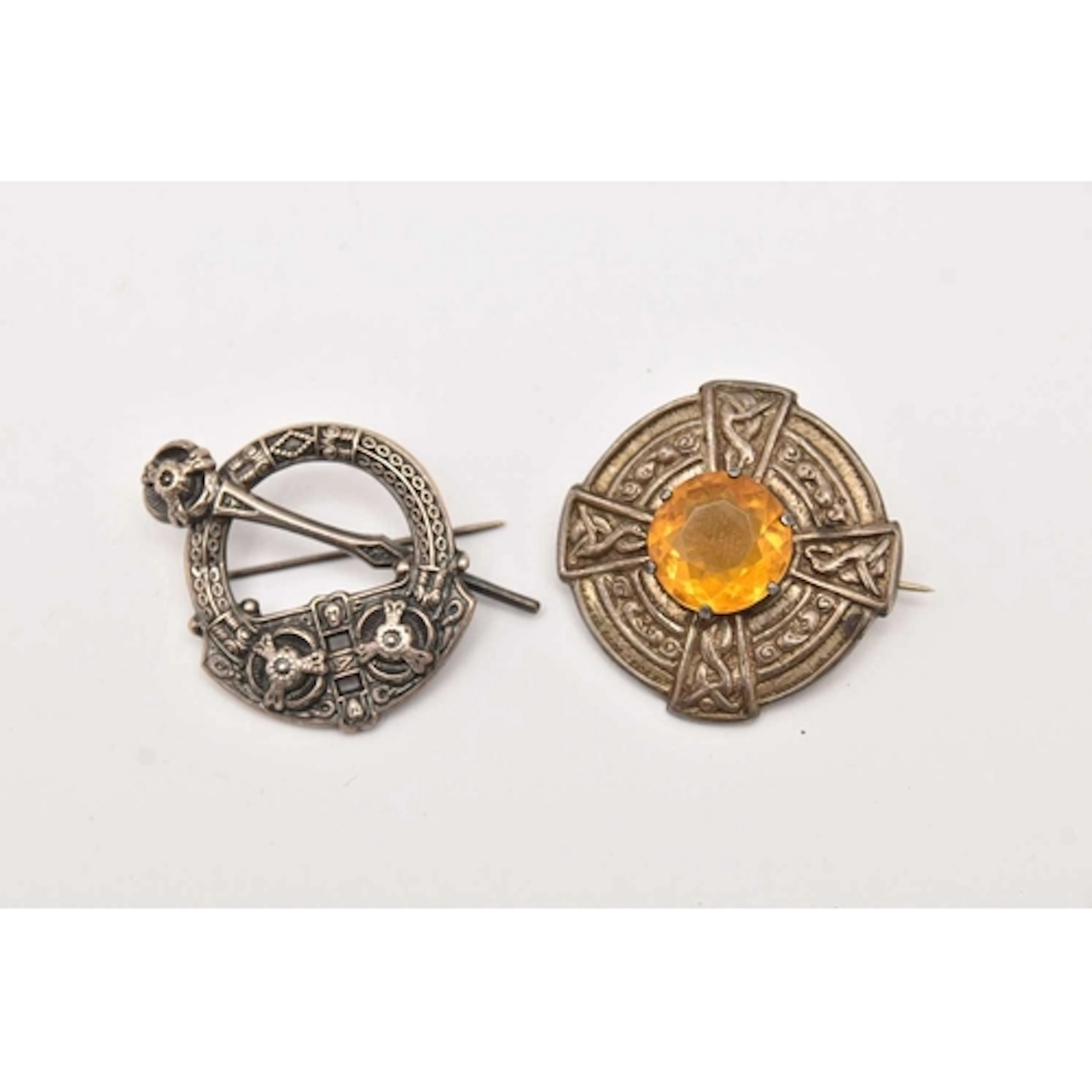 TWO SILVER BROOCHES, each fitted with a brooch pin and C cla...