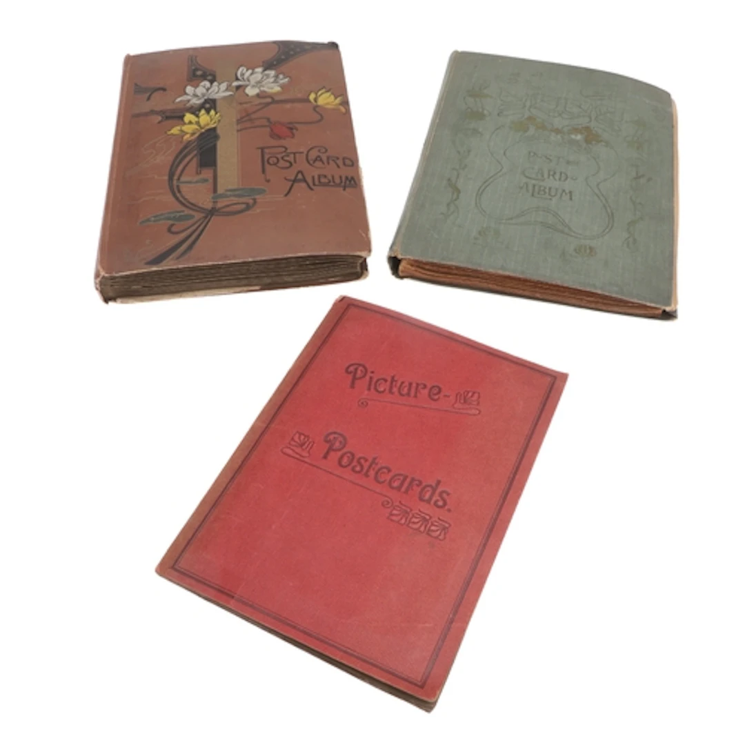 THREE VINTAGE POSTCARD ALBUMS - INCLUDING GREAT BRITAIN. A v...
