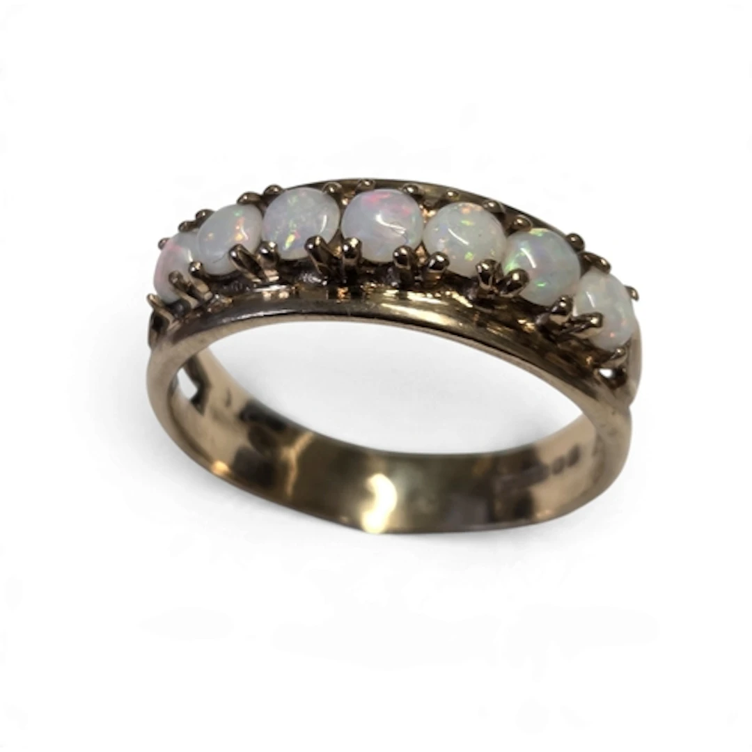 A good vintage 9-carat gold seven-stone opal ring, the gradu...