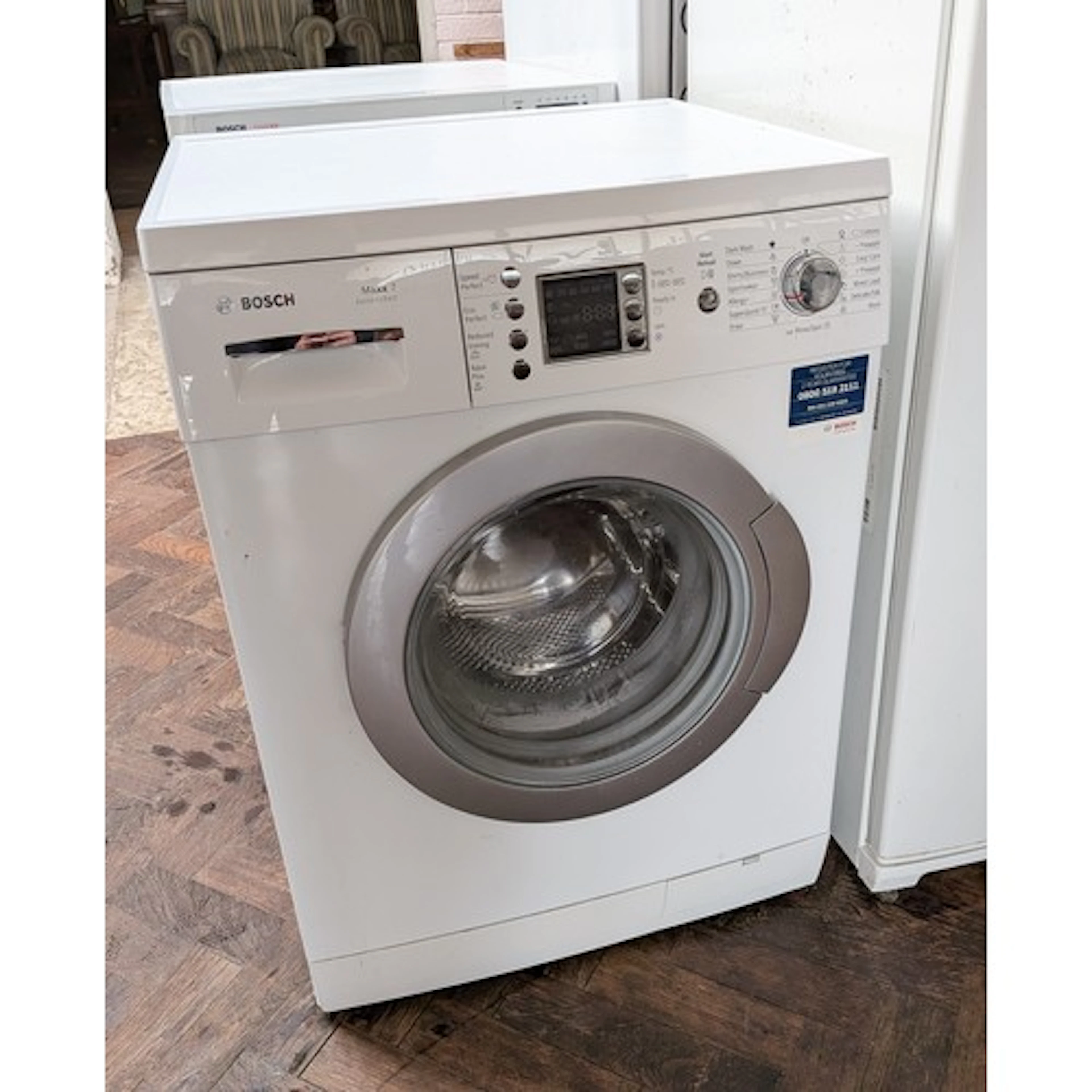 A Bosch Maxx 7 washing machine with digital display