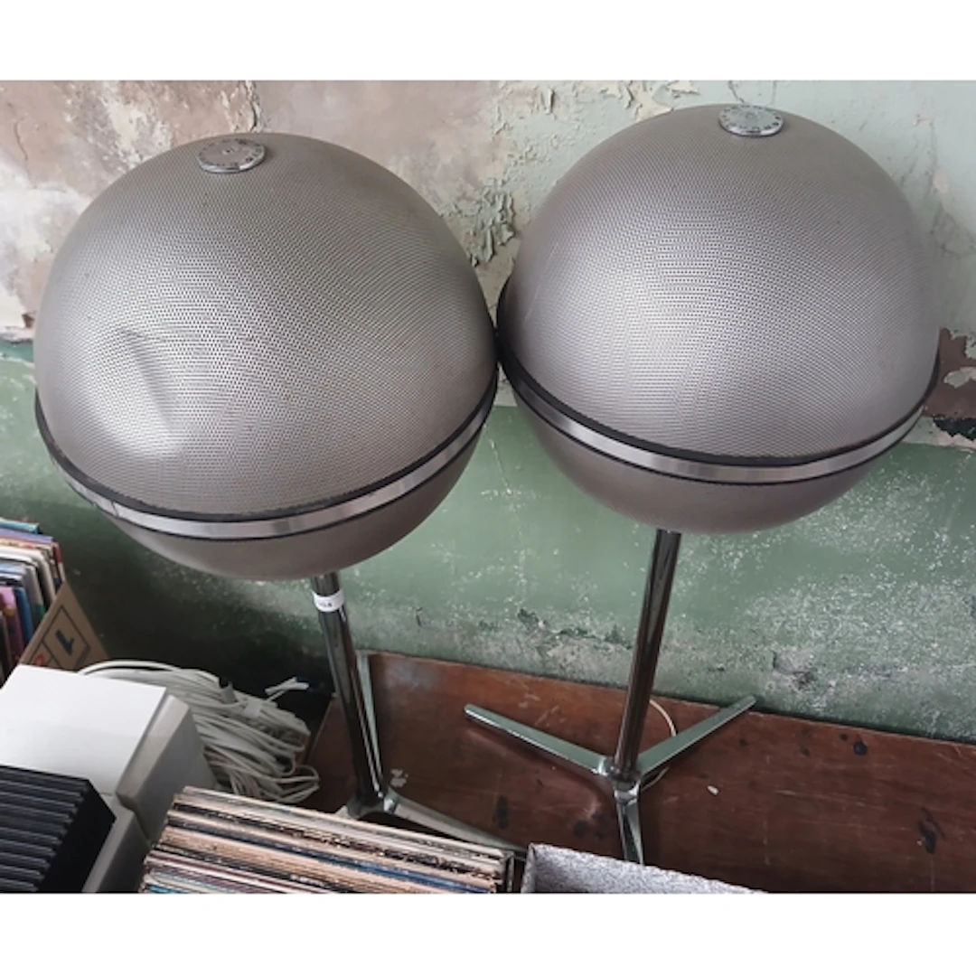 A pair of Grundig Audiorama spherical spkears on stands.
