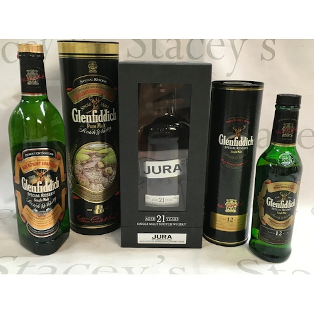 Three single malt Scotch whiskies. Two Glenfiddich bottles, ...