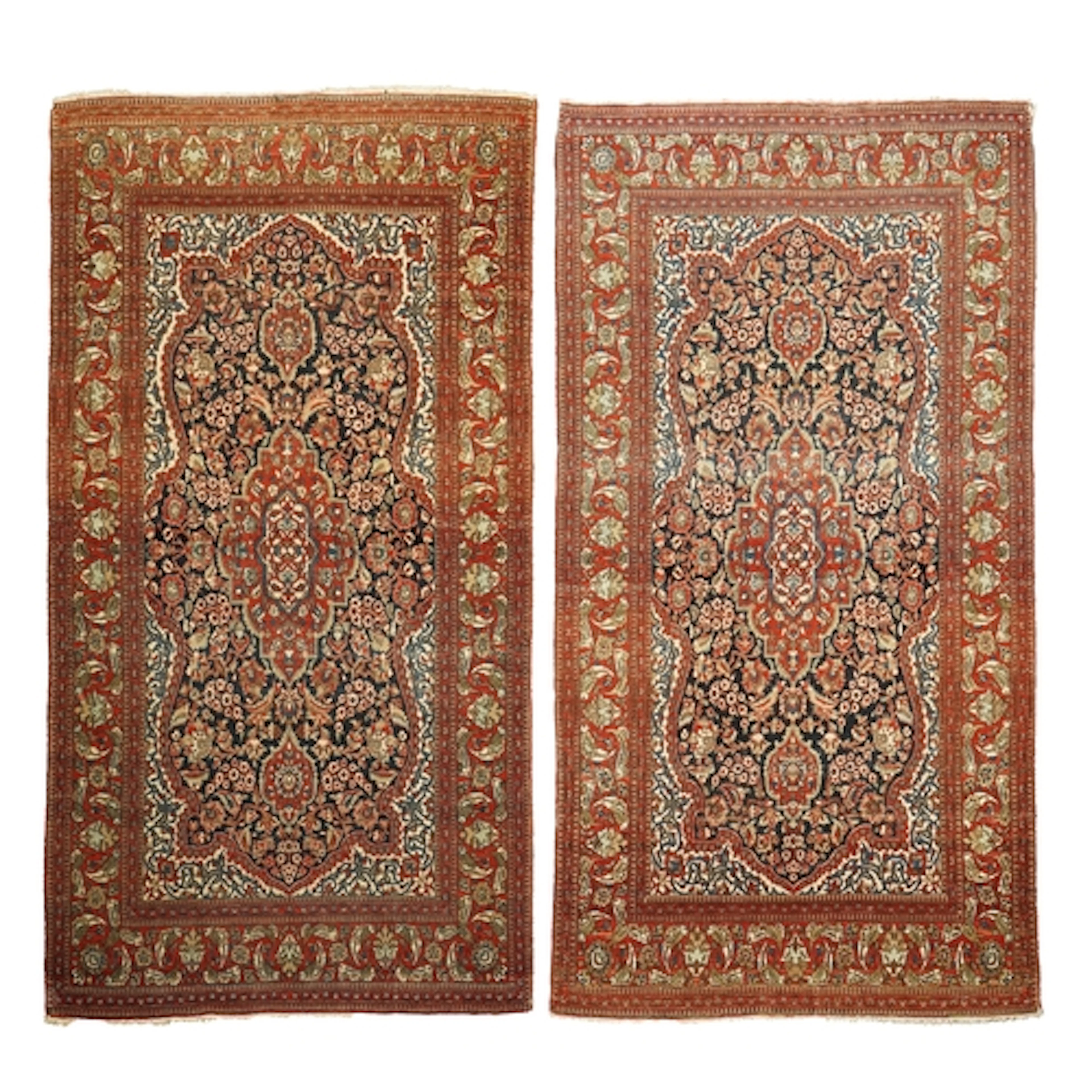 A pair of antique Ispahan blue ground rugs, early 20th centu...