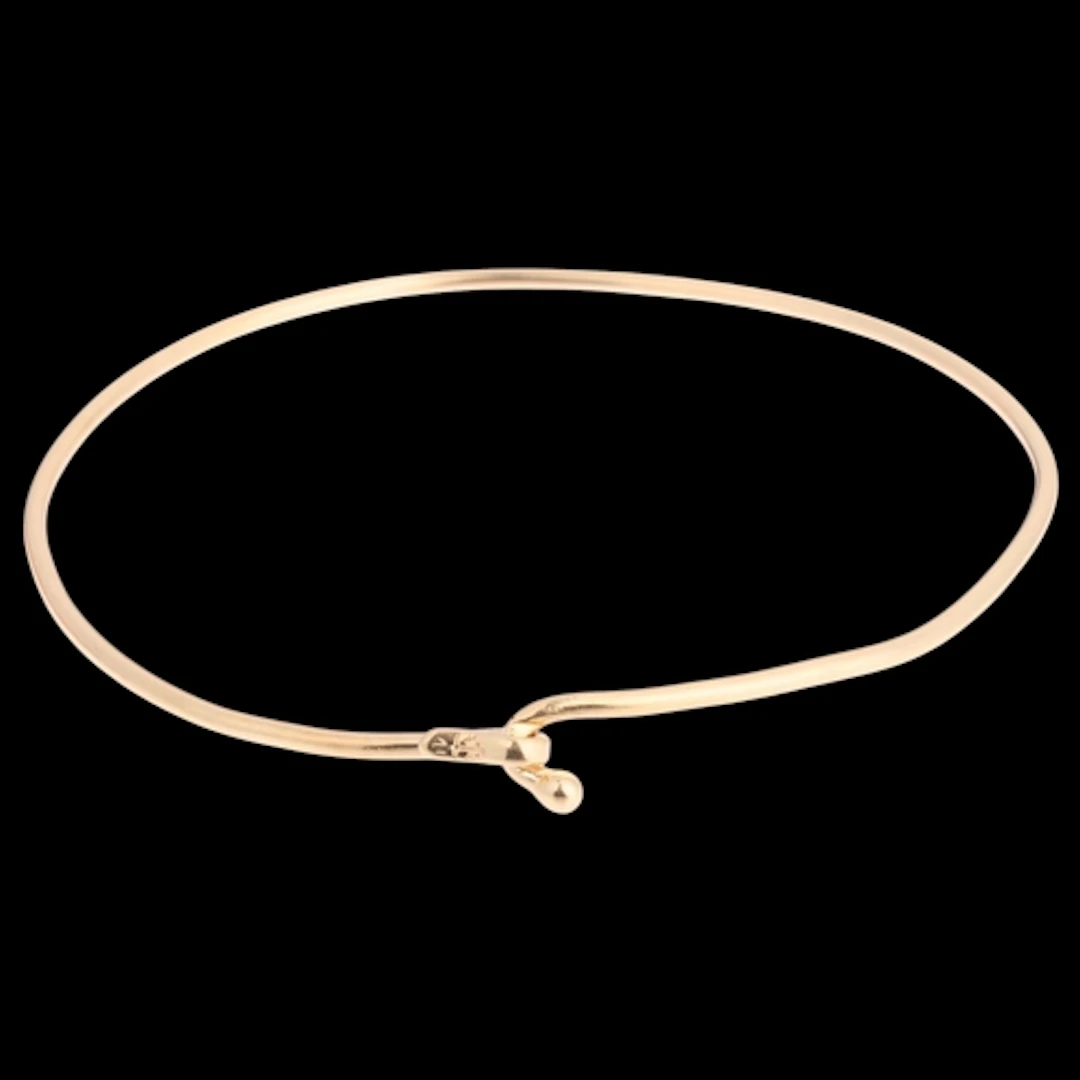 A 14ct gold torque bangle, plain polished form, anchor maker...
